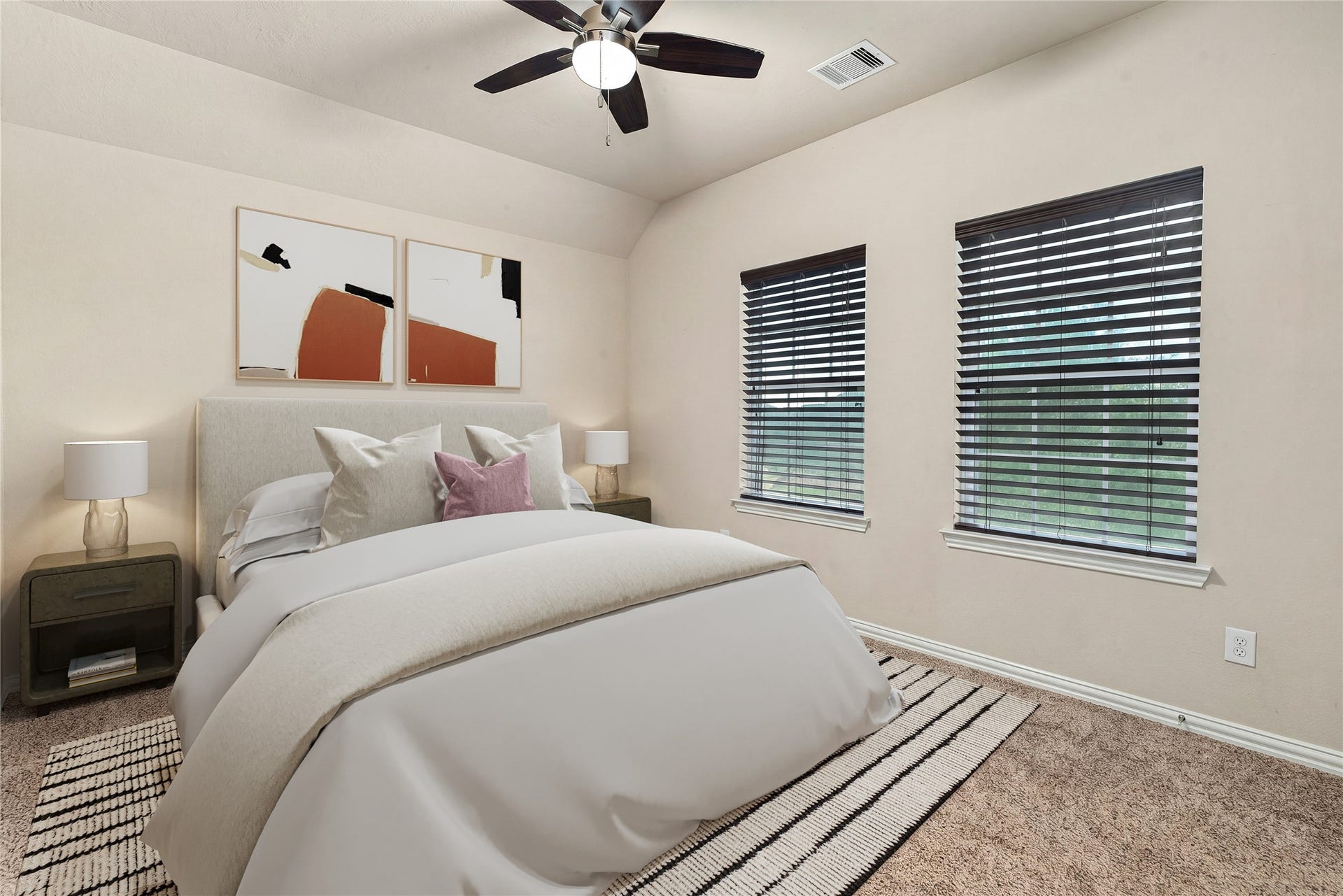 7018 Pearl Terrace Lane, Richmond, TX 77469 Bright secondary bedroom featuring a vaulted ceiling, two windows for abundant natural light, and a ceiling fan for year-round comfort. *Virtually Staged
