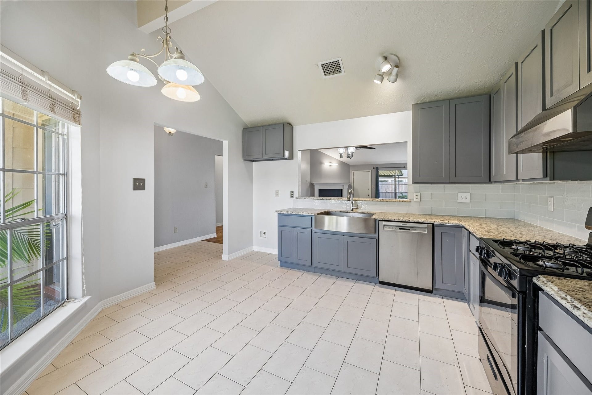 16911 Summer Dawn Place, Houston, TX 77095 Kitchen opens directly toward the dining and living areas, creating an easy connection between the main gathering spaces. A large window keeps the room bright throughout the day.