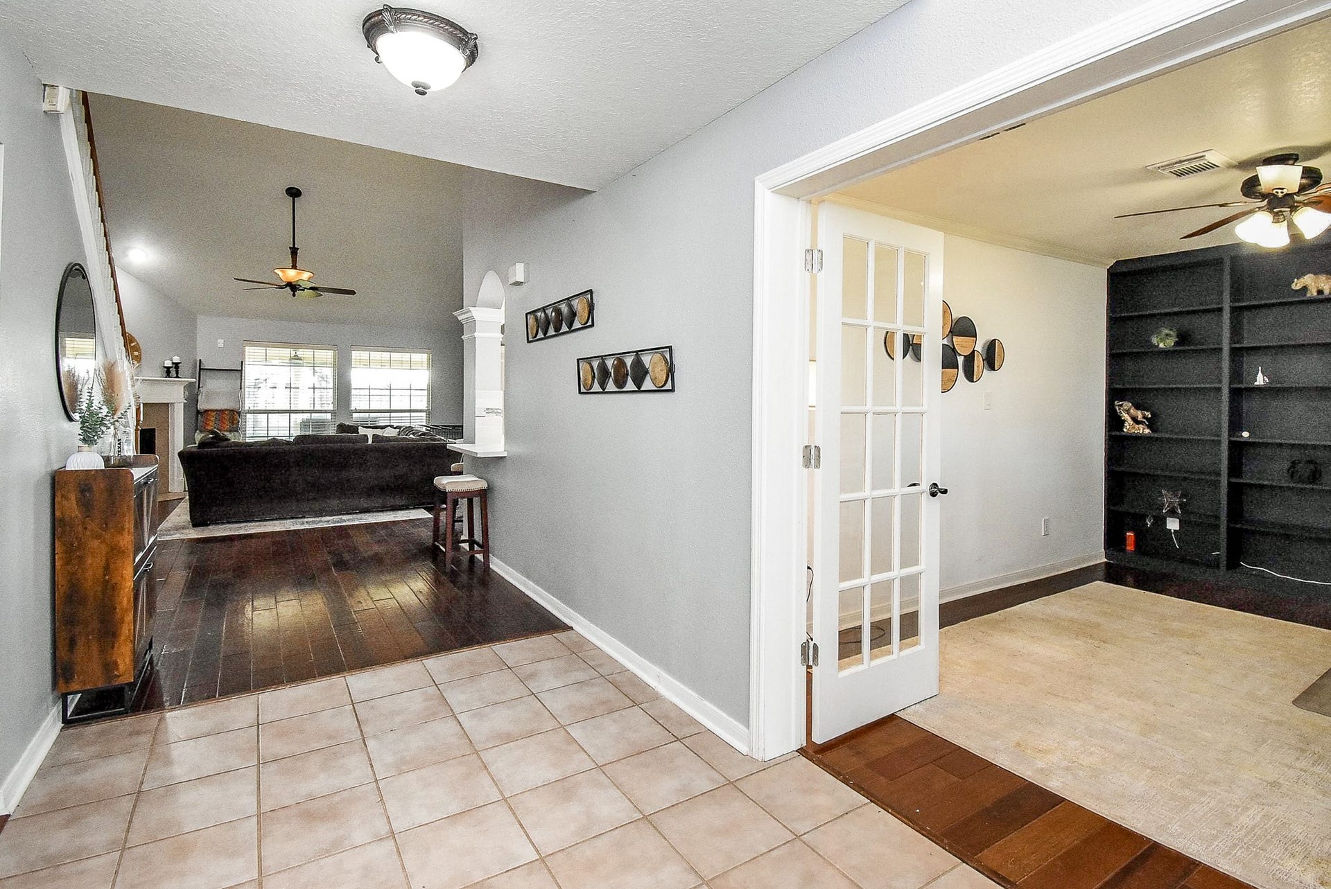 6703 Morning Glory Trace, Richmond, TX 77407 A room with French doors and built-in shelves is perfect for a home office or library.