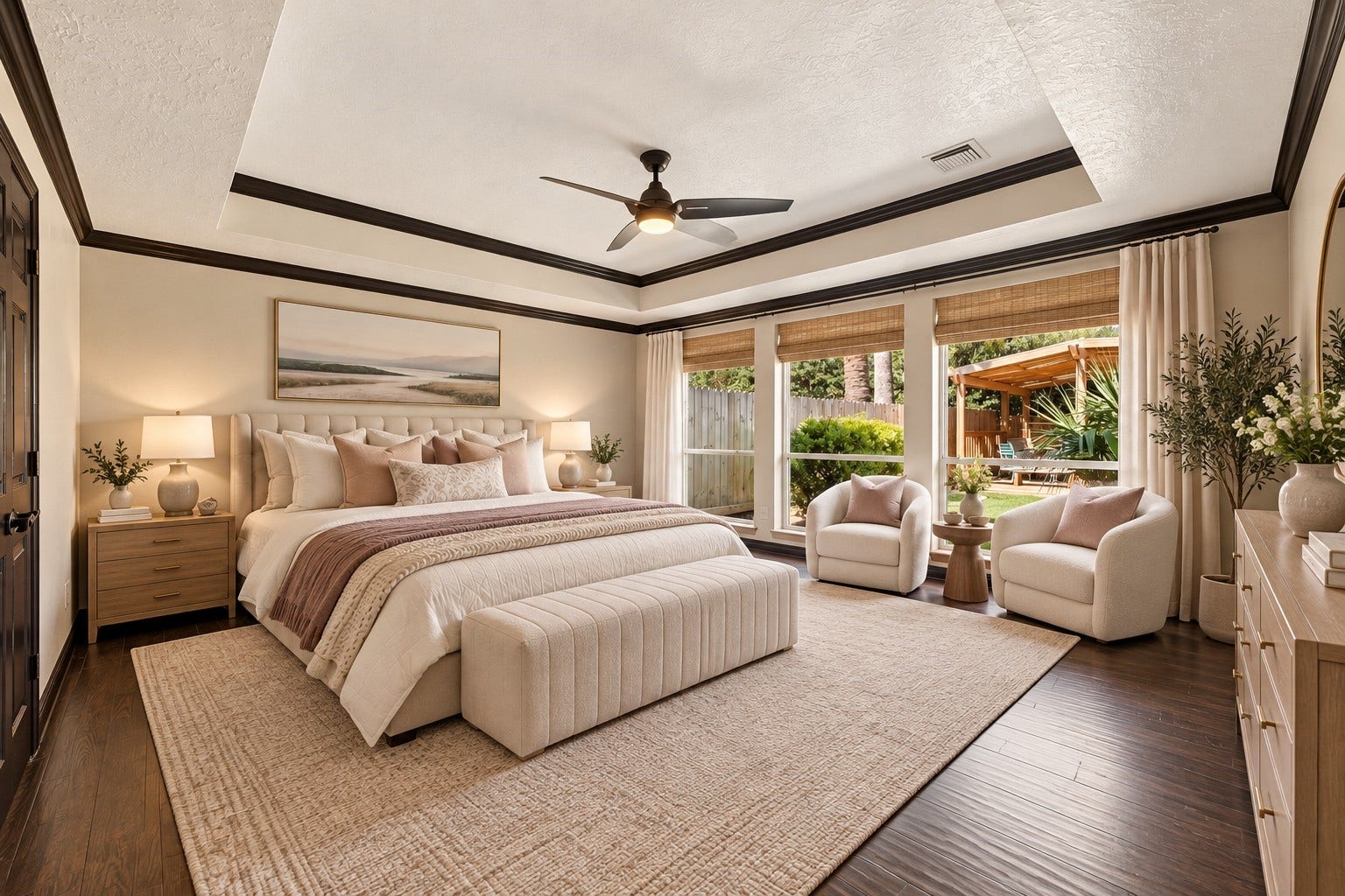 201 Lago Vista Street, League City, TX 77565 Experience luxury in the primary bedroom with elegant tray ceilings, located on the first floor, offering serene backyard views.