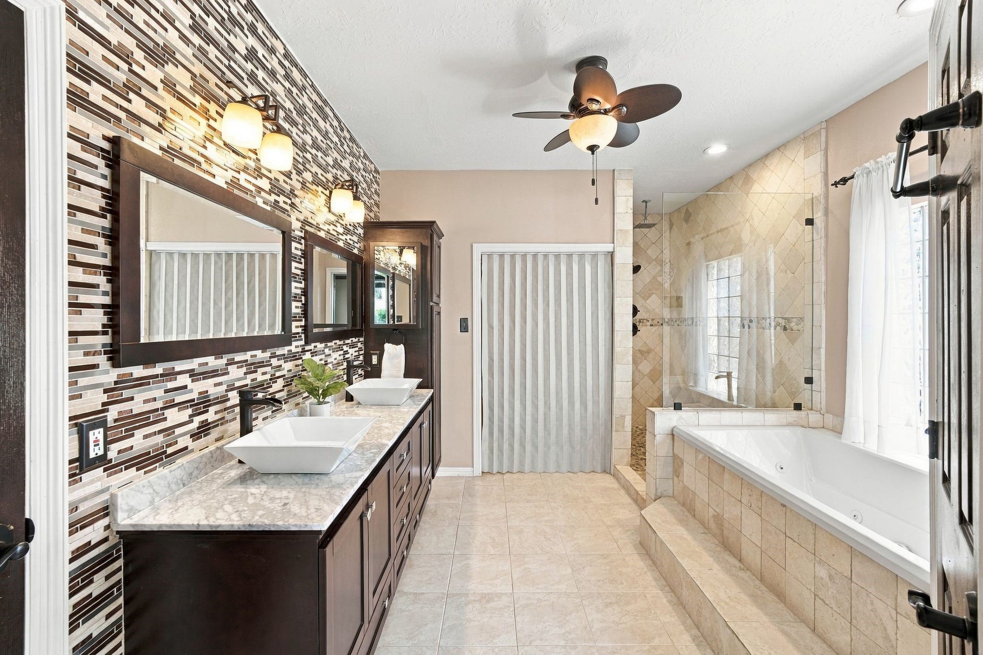 201 Lago Vista Street, League City, TX 77565 Experience luxury with a spacious walk-in closet and elegant separate shower, perfect for your serene retreat.