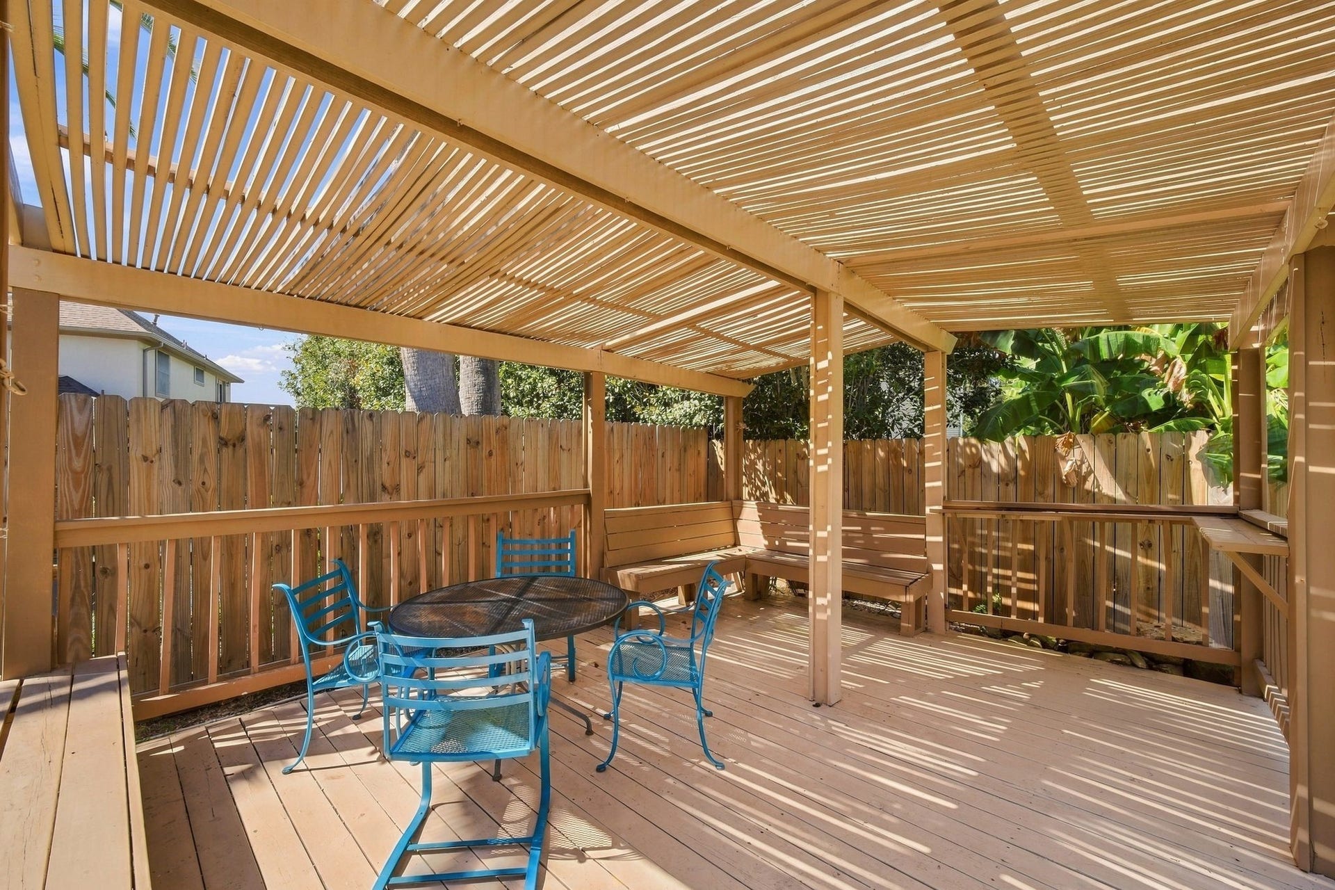 201 Lago Vista Street, League City, TX 77565 Unwind in your private oasis under the inviting backyard pergola, perfect for relaxation and gatherings.