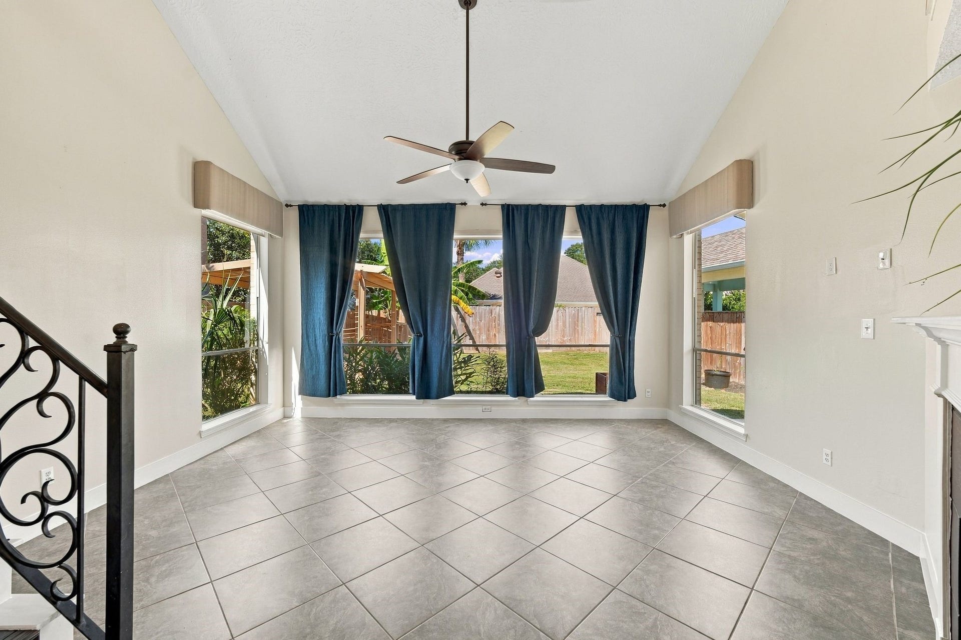 201 Lago Vista Street, League City, TX 77565 Bright and inviting, this open space features large windows that flood the room with natural light, offering a blank canvas ready for your personal touch.
