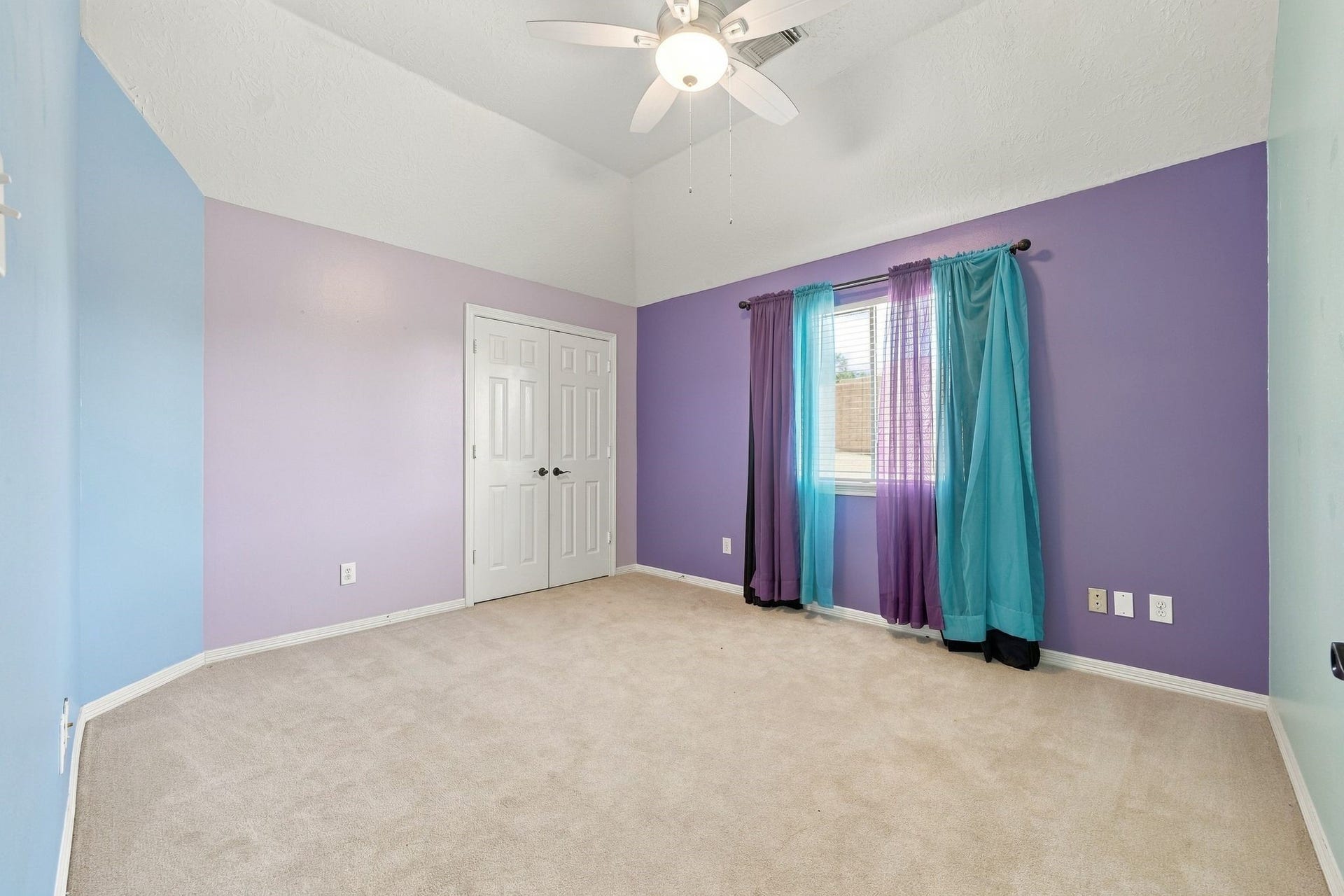 201 Lago Vista Street, League City, TX 77565 Bright and airy bedroom with vibrant, playful walls and a cozy atmosphere, ready for your personal touch.
