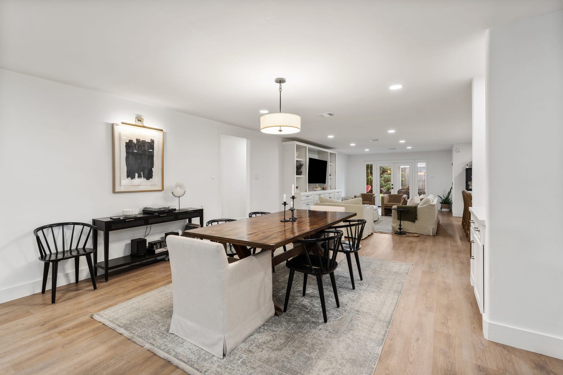 9206 Kapri Lane, Houston, TX 77025 The dining area opens directly to the main living space, creating excellent flow throughout the home while a statement ceiling fixture completes the contemporary design.