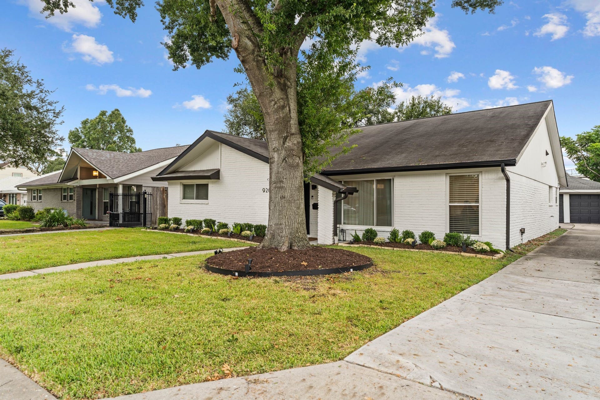 9206 Kapri Lane, Houston, TX 77025 Another view, highlighting the extended driveway leading to the detached garage.