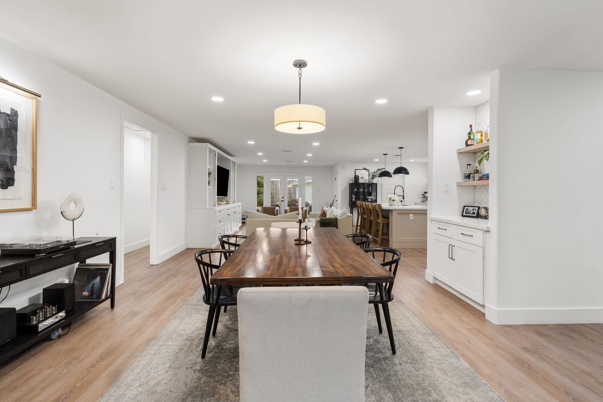 9206 Kapri Lane, Houston, TX 77025 The dining room showcases the homes open layout, connecting the dining, kitchen and living spaces with continuous flooring, recessed lighting and built-in cabinetry.