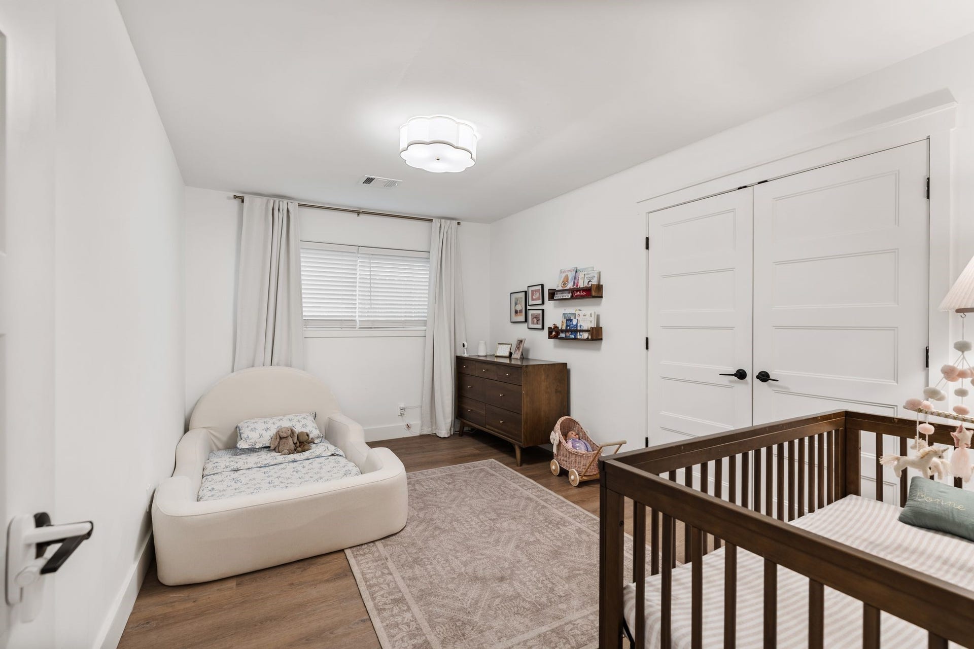 9206 Kapri Lane, Houston, TX 77025 Bright secondary bedroom features updated flooring, a large window, contemporary overhead lighting and double-door closet.