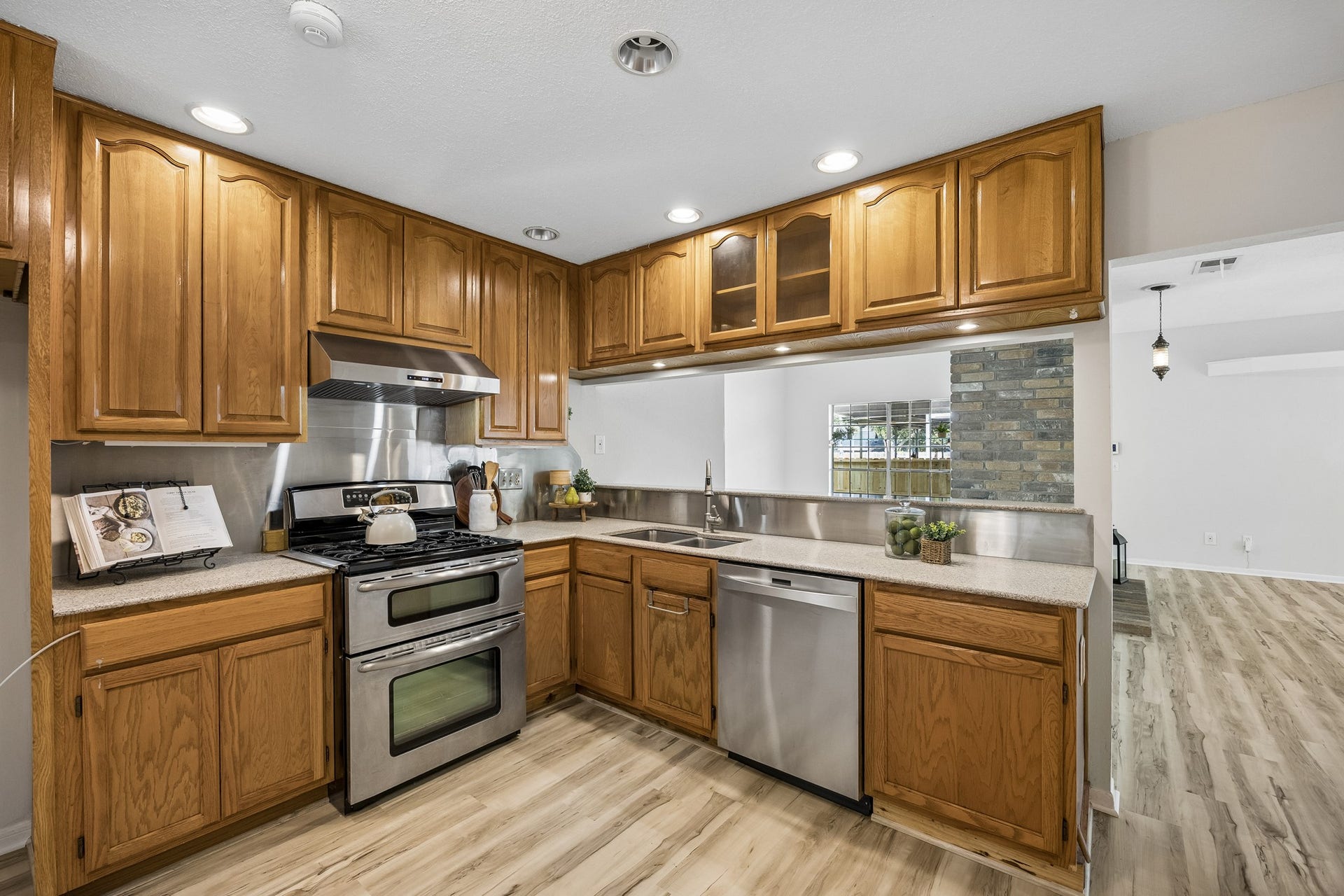 2716 Village Mills Drive, Pearland, TX 77584 Updated kitchen with corian counters, updated appliances and abundant cabinetry.