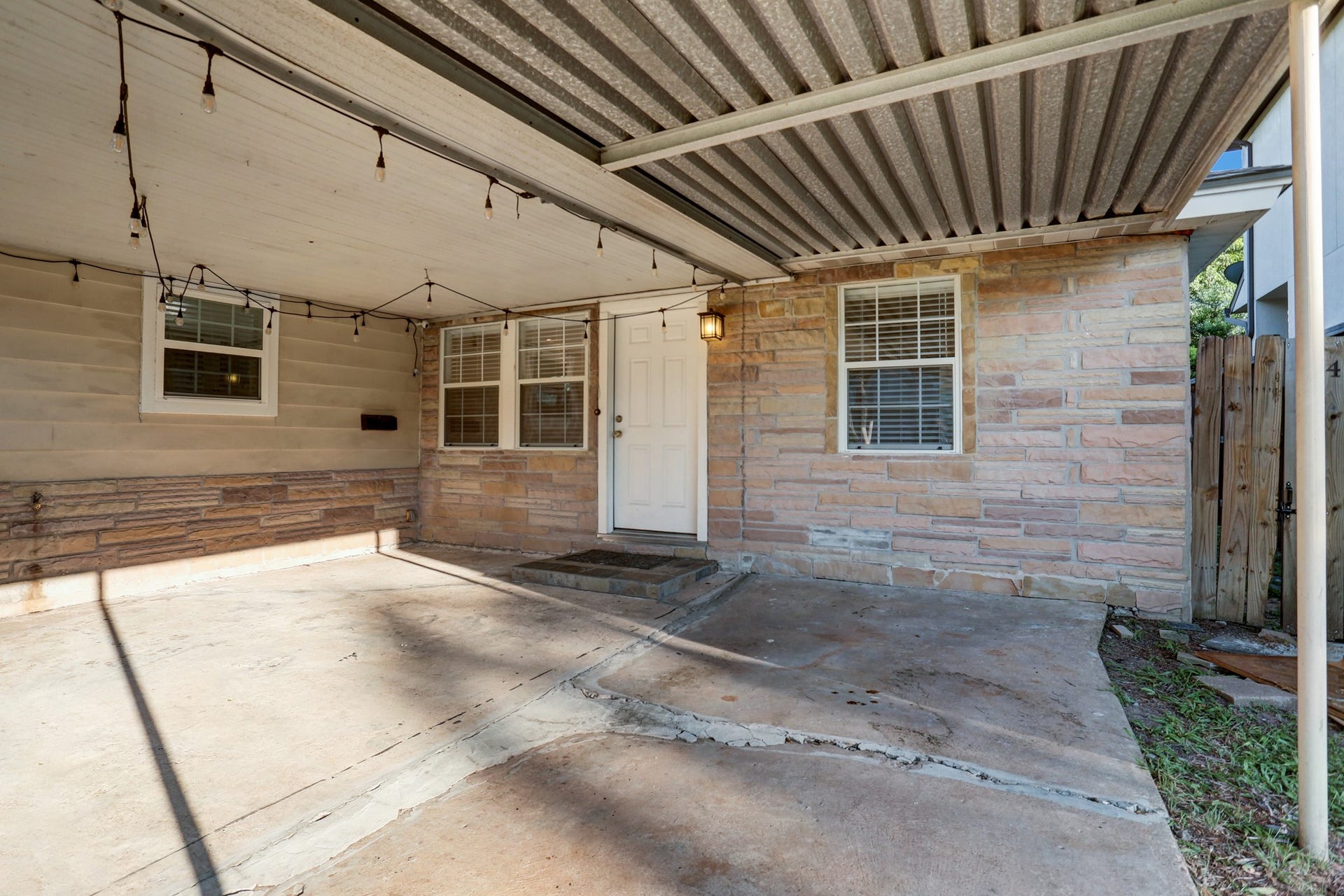 4419 Cynthia, Bellaire, TX 77401 There is a very large covered patio and a one-car portecochiere. The original garage had been converted to a bedroom or study.