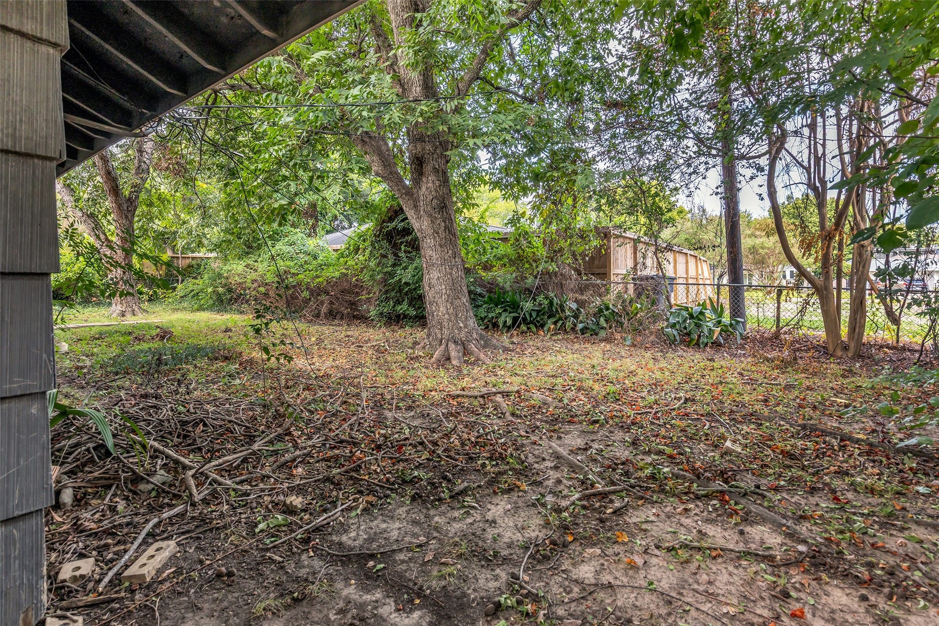 5326 Judalon Lane, Houston, TX 77056 Shade trees and a deep backyard give you room to imagine your future outdoor space.
