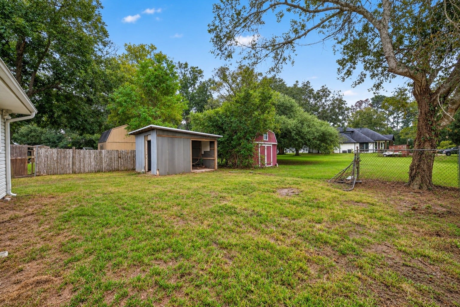 4701 Cherry Street, Santa Fe, TX 77517 Side Yard view with metal building