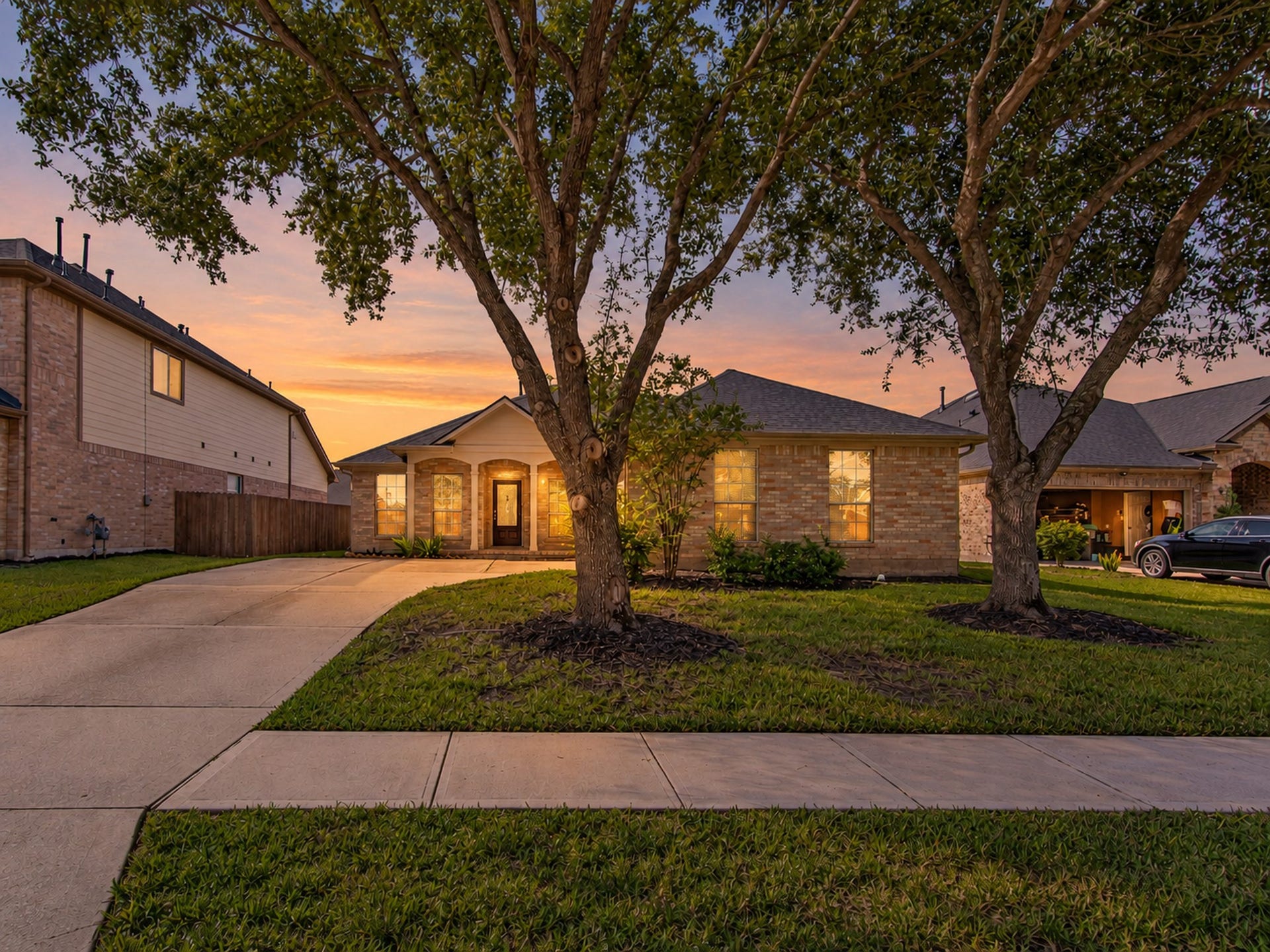 12906 Brook Arbor Court, Pearland, TX 77584 Welcome to this 3-bedroom, 2.5-bath home with a brick exterior, mature trees, and an inviting front lawn