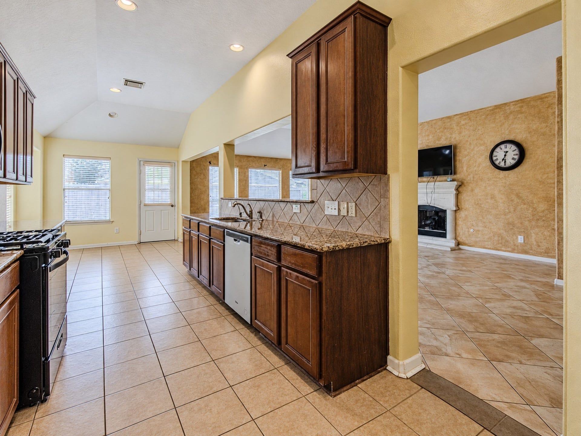 12906 Brook Arbor Court, Pearland, TX 77584 The kitchen connects to the main living area for easy everyday living and entertaining