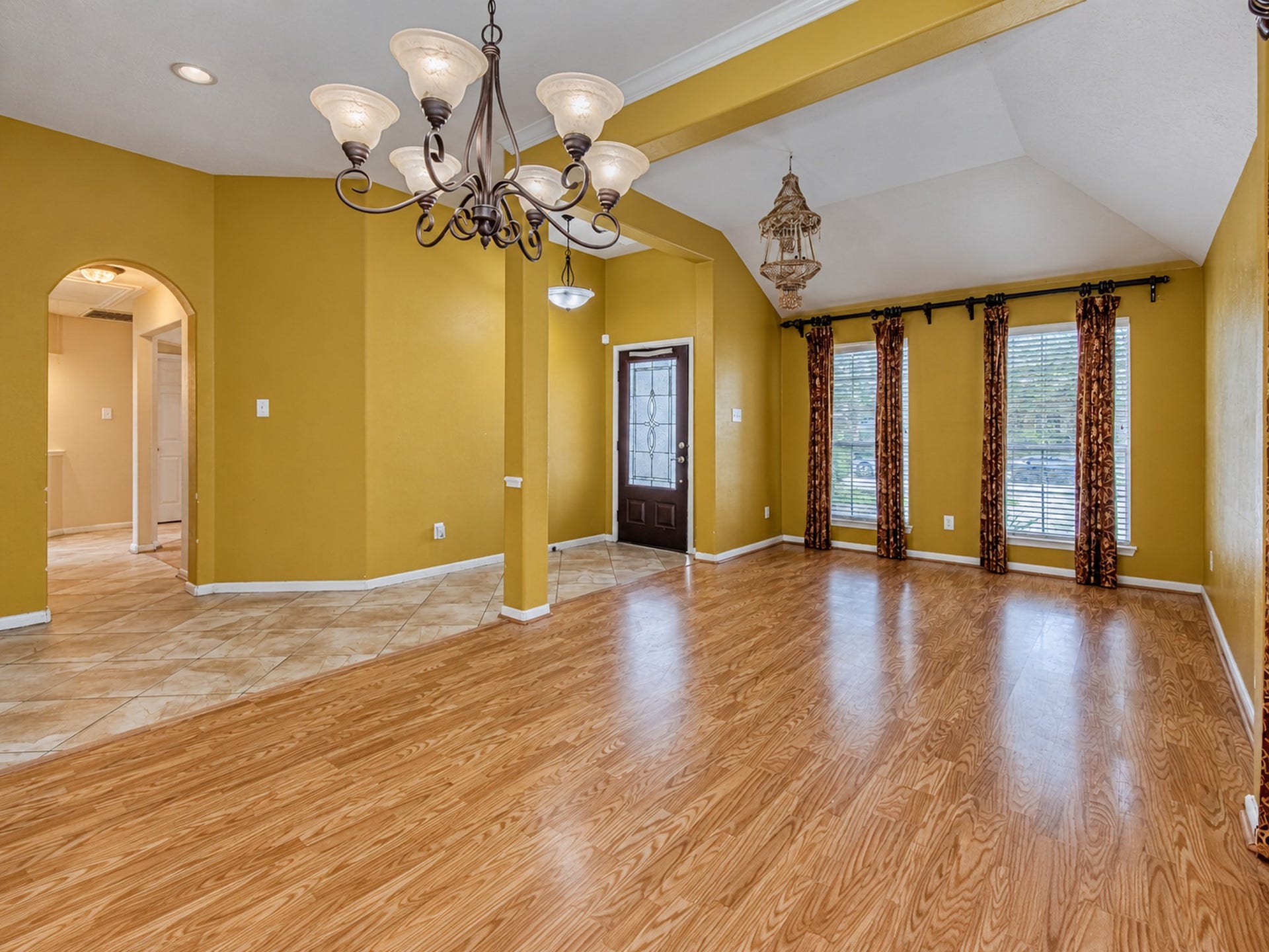 12906 Brook Arbor Court, Pearland, TX 77584 Another view of the formal dining area with tall windows and decorative ceiling details