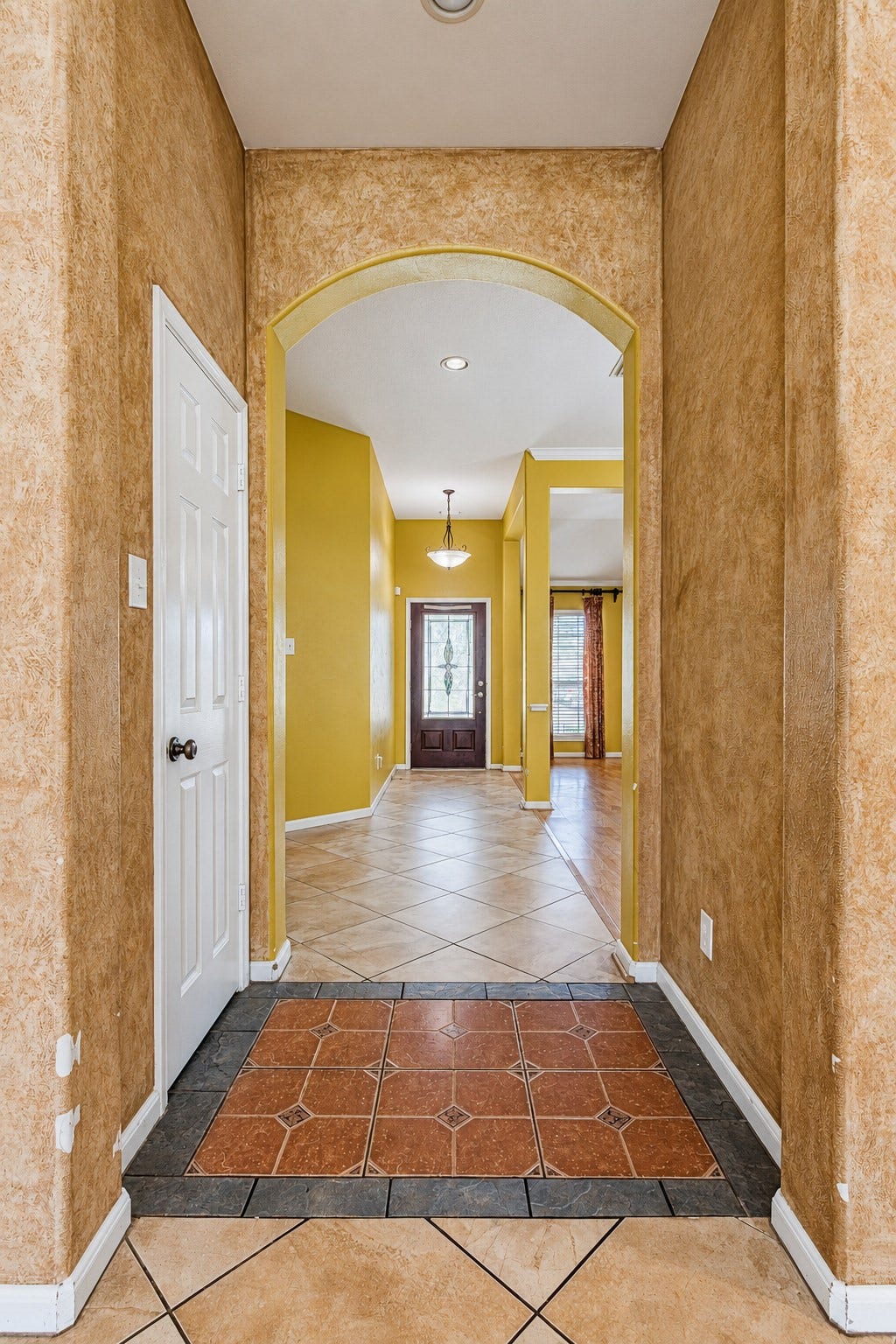 12906 Brook Arbor Court, Pearland, TX 77584 View through the entry highlighting the home's architectural details and open sightlines