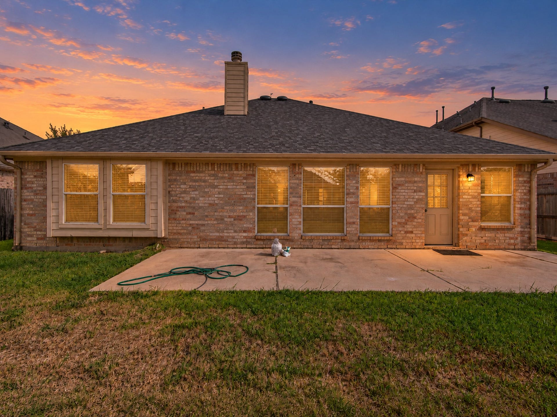 12906 Brook Arbor Court, Pearland, TX 77584 A spacious concrete patio offers room for outdoor seating and entertaining