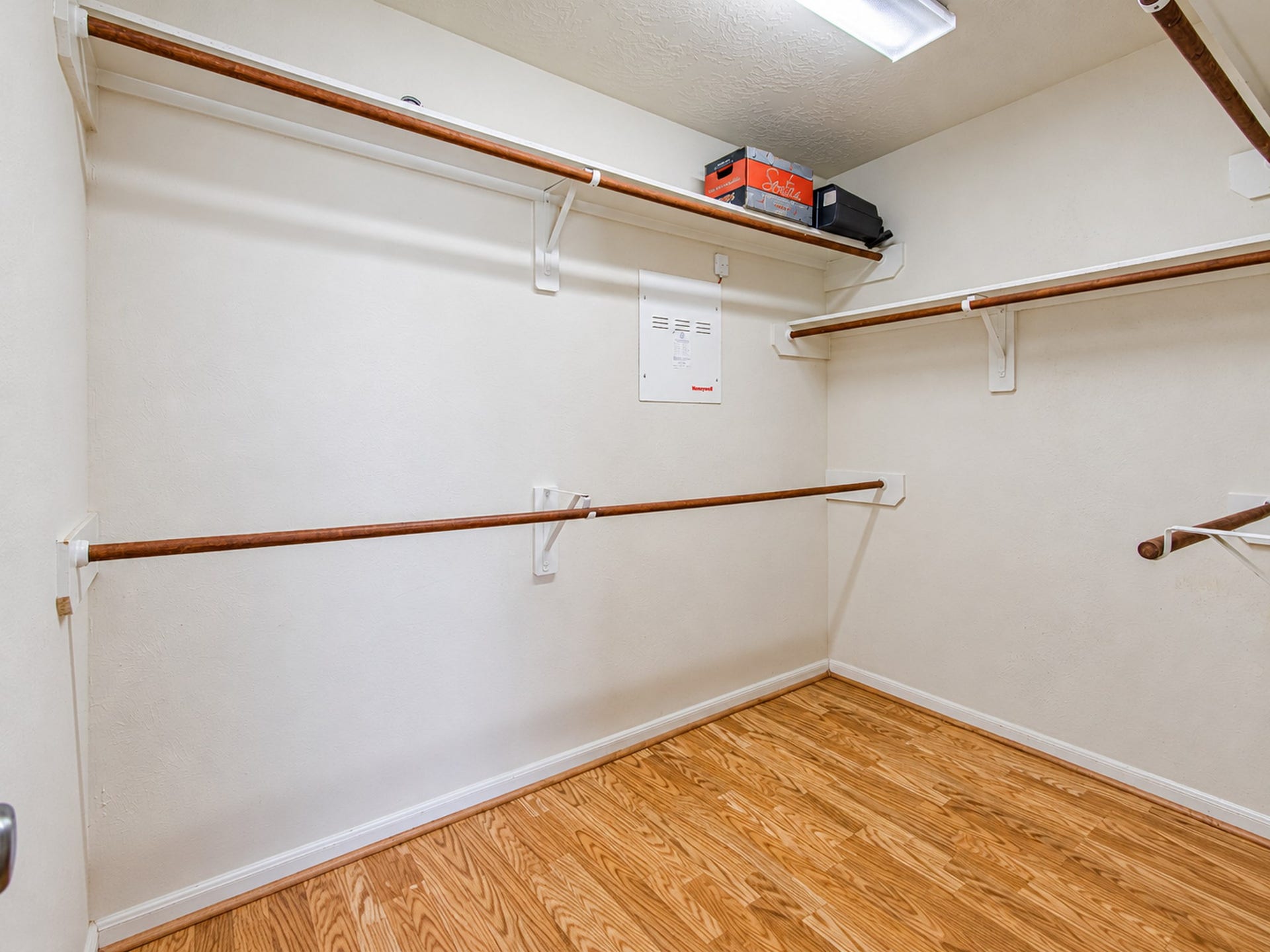 12906 Brook Arbor Court, Pearland, TX 77584 A walk-in closet offers wraparound hanging space and upper shelving