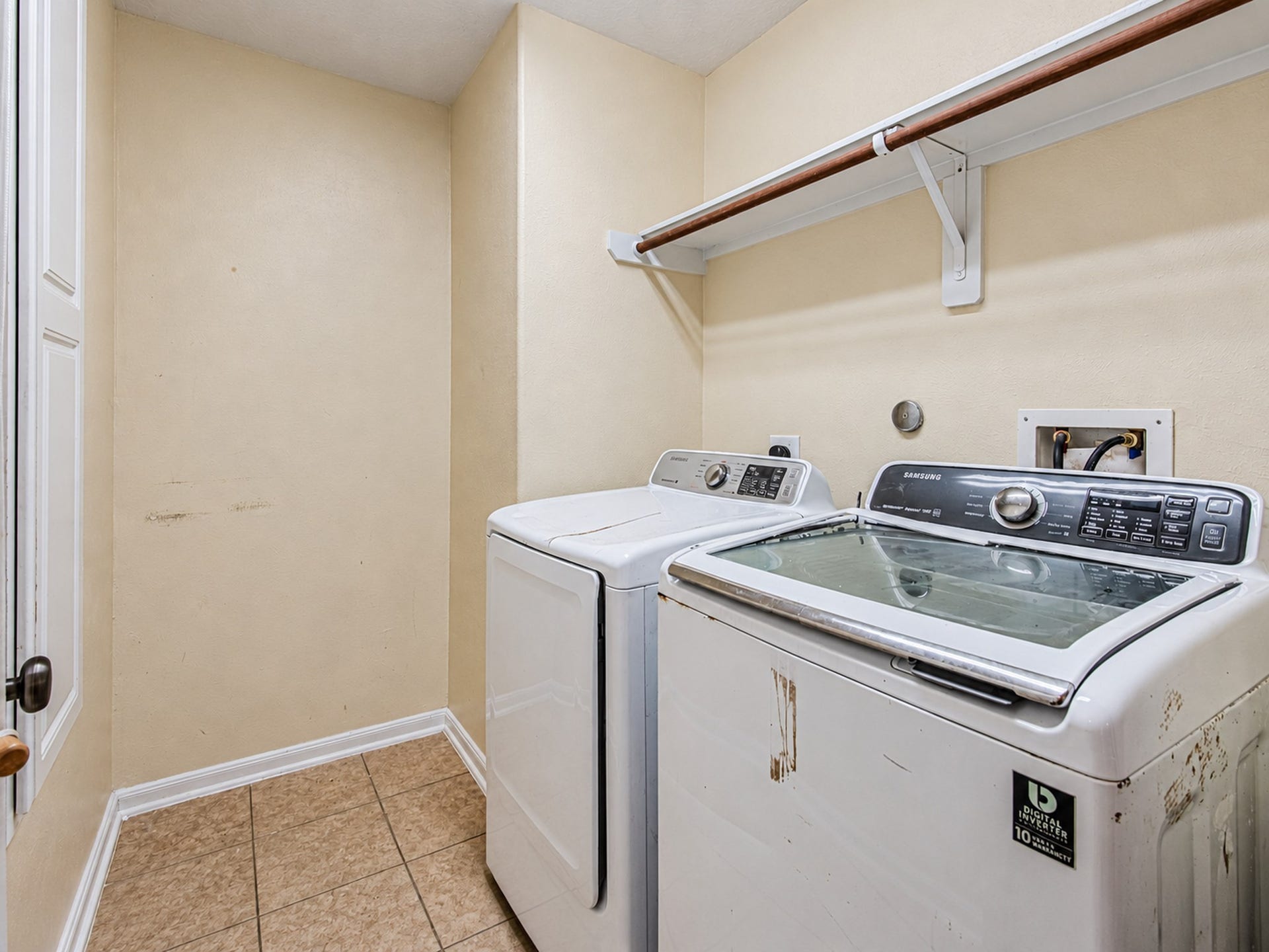 12906 Brook Arbor Court, Pearland, TX 77584 A dedicated laundry room includes overhead shelving for convenient storage