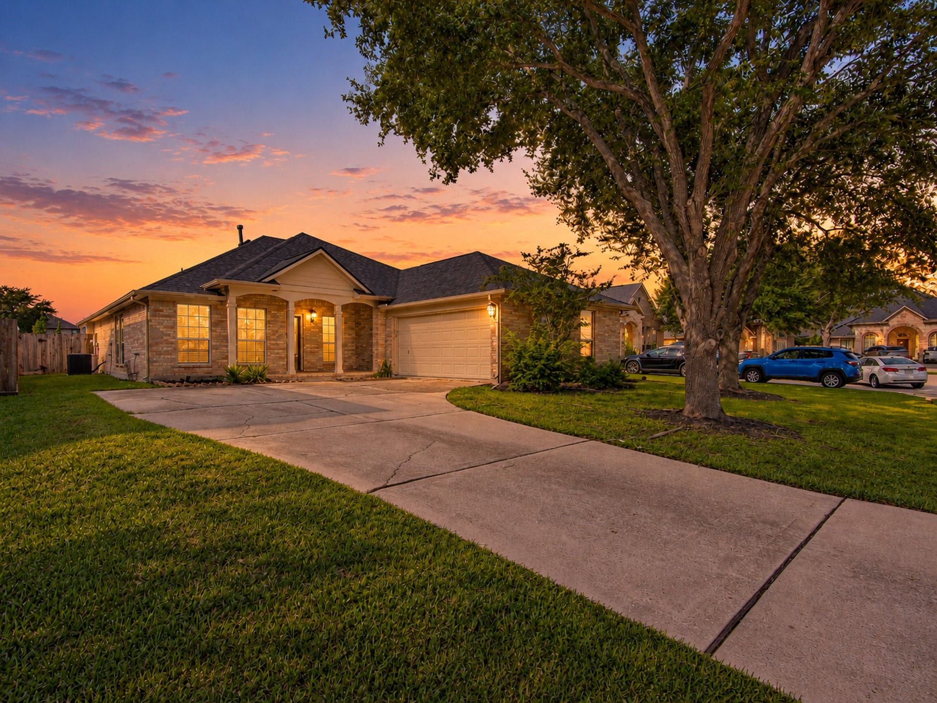 12906 Brook Arbor Court, Pearland, TX 77584 A wide driveway and attached garage complement the home's welcoming exterior
