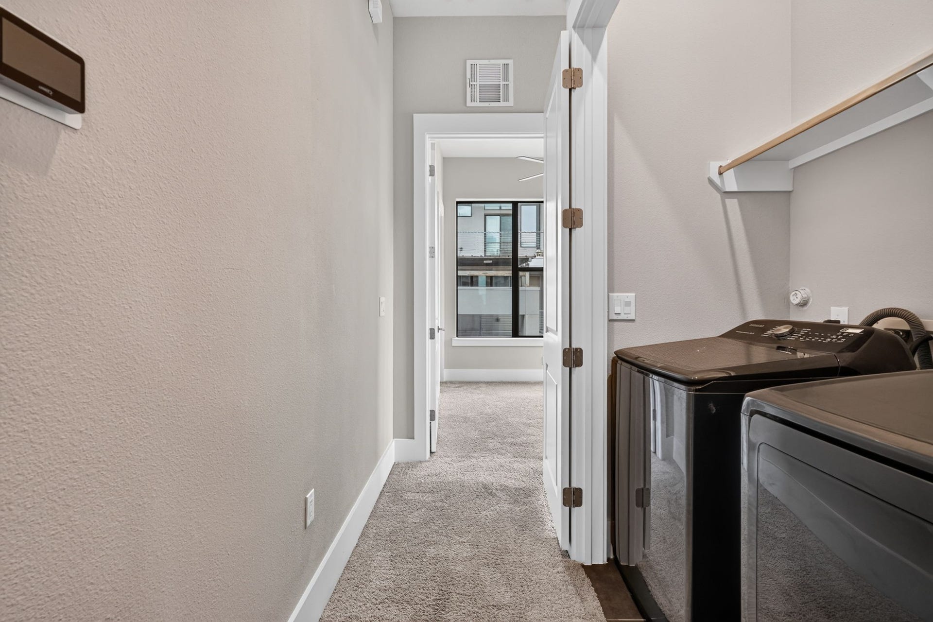 The utility closet is conveniently located on the 3rd floor. The washer & dryer are included in the sale