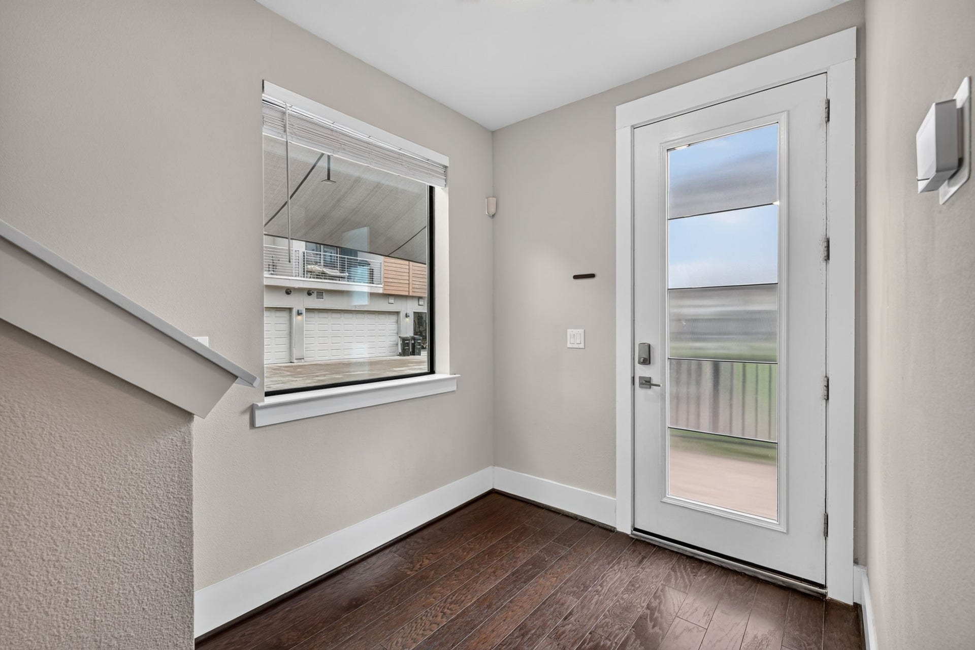 Another view of the front entrance w/ large window and lots of natural light.