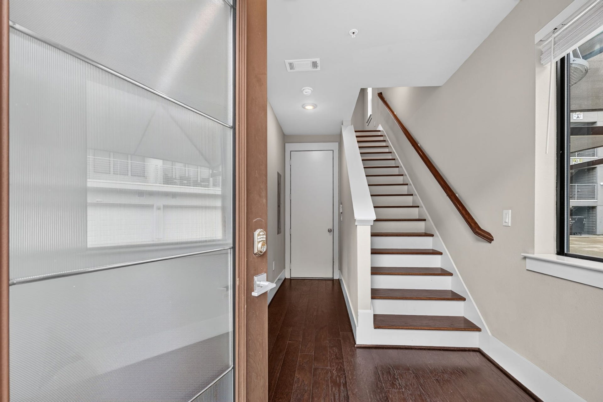 As you enter the front door, secondary bed #1 will be on the left, private garage entrace straight ahead and stairs leading to the Kitchen/Living on the 2nd floor