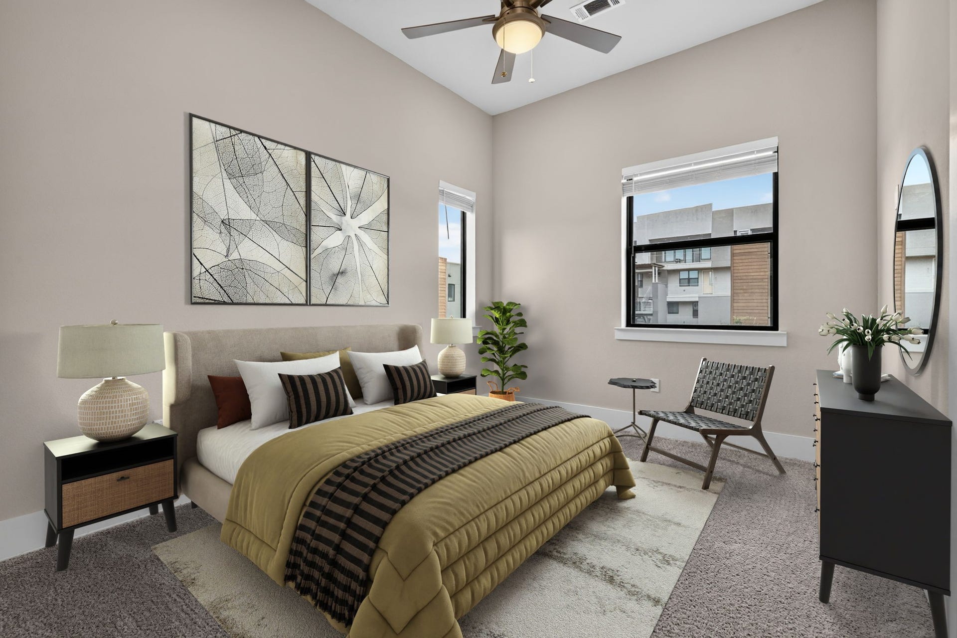 The primary bedroom is located on the 3rd floor...both have en-suite baths. Photo has been virtually staged