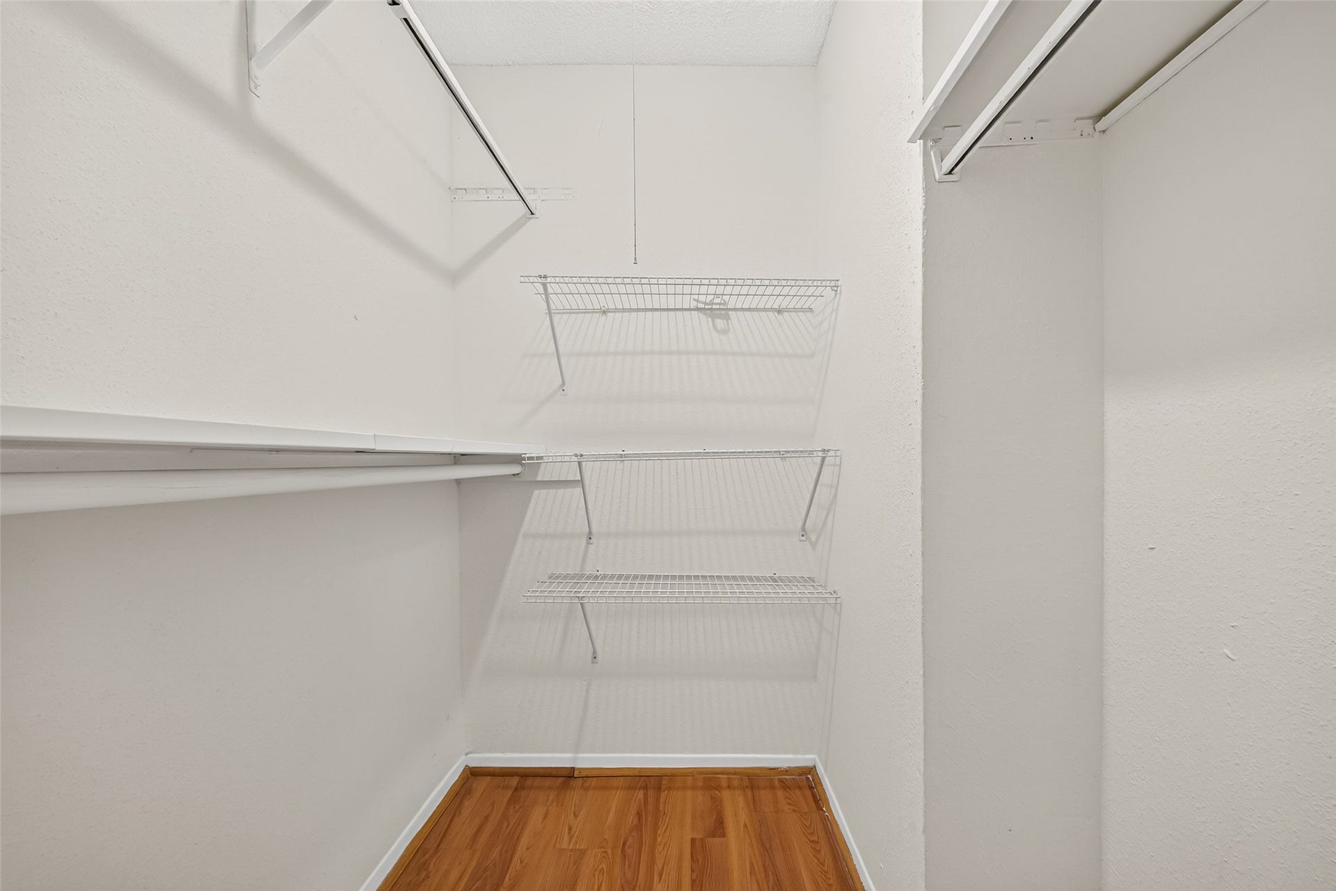 9523 Pagewood Lane, #9523, Houston, TX 77063 Spacious walk-in closet and ample hanging space for organized storage.
