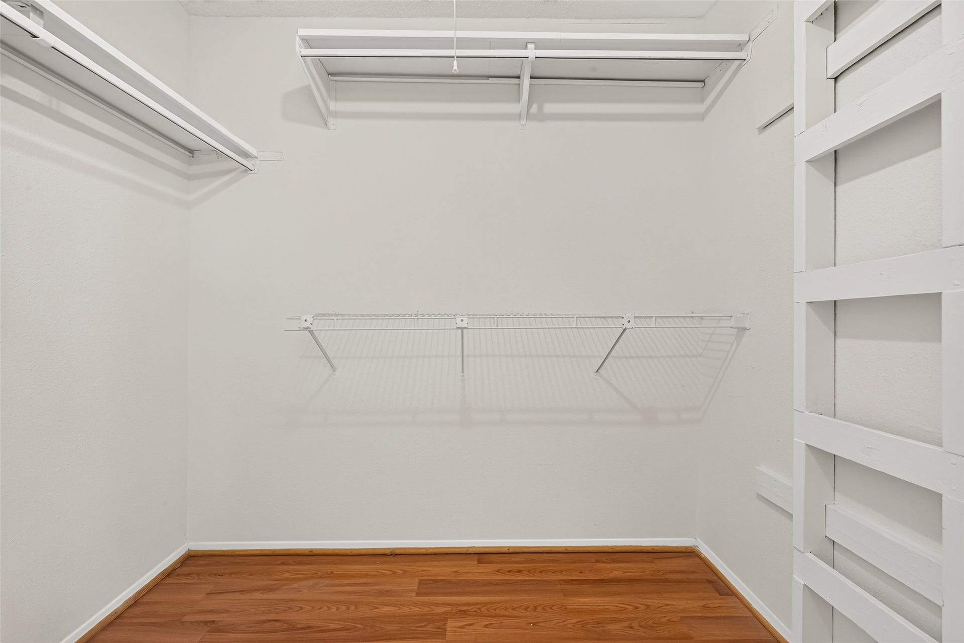 9523 Pagewood Lane, #9523, Houston, TX 77063 Spacious walk-in closet and ample hanging space for organized storage.
