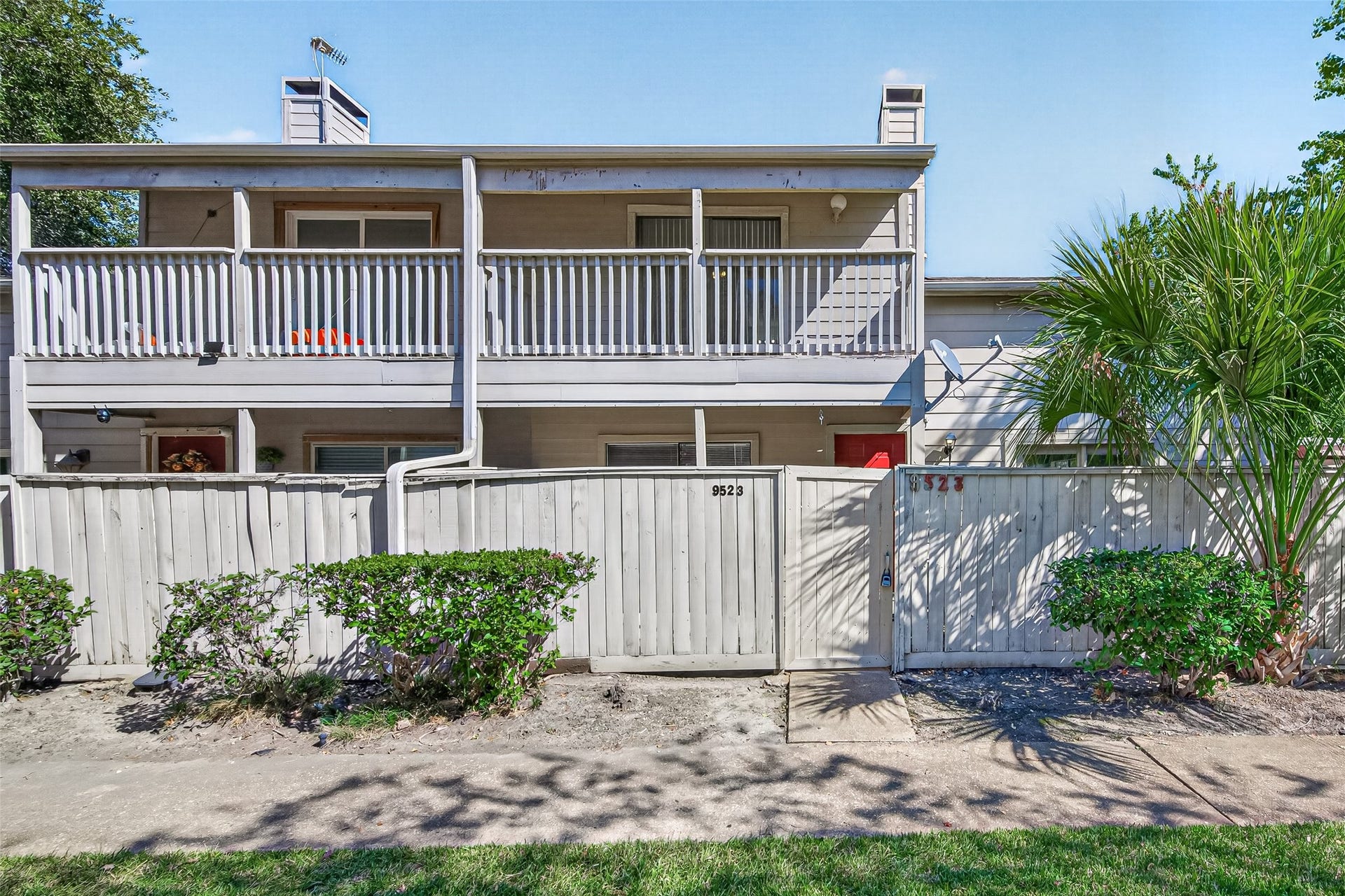 9523 Pagewood Lane, #9523, Houston, TX 77063 Gated entry with a wooden fence that offers privacy for yur front porch.