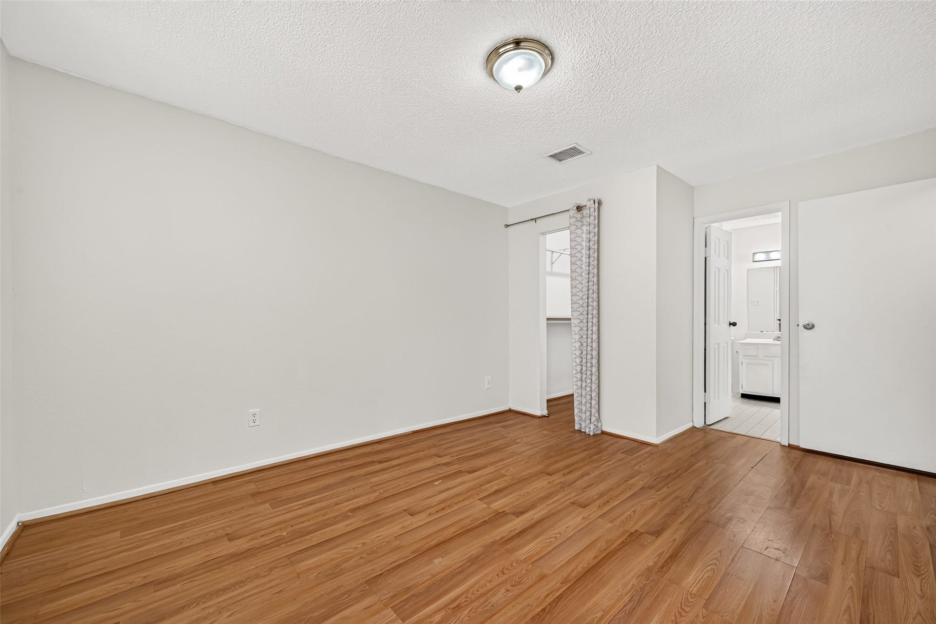 9523 Pagewood Lane, #9523, Houston, TX 77063 Anotherview of primary bedroom with a walk-in closet and full bath.