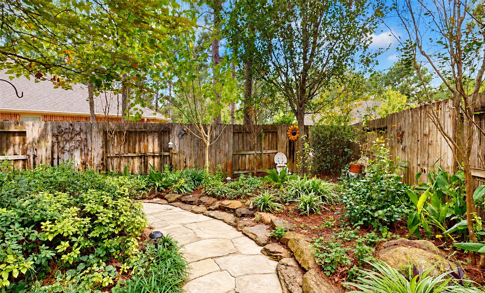 126 Bellardia Court, Montgomery, TX 77316 Beautifully designed perennial garden! Low upkeep!