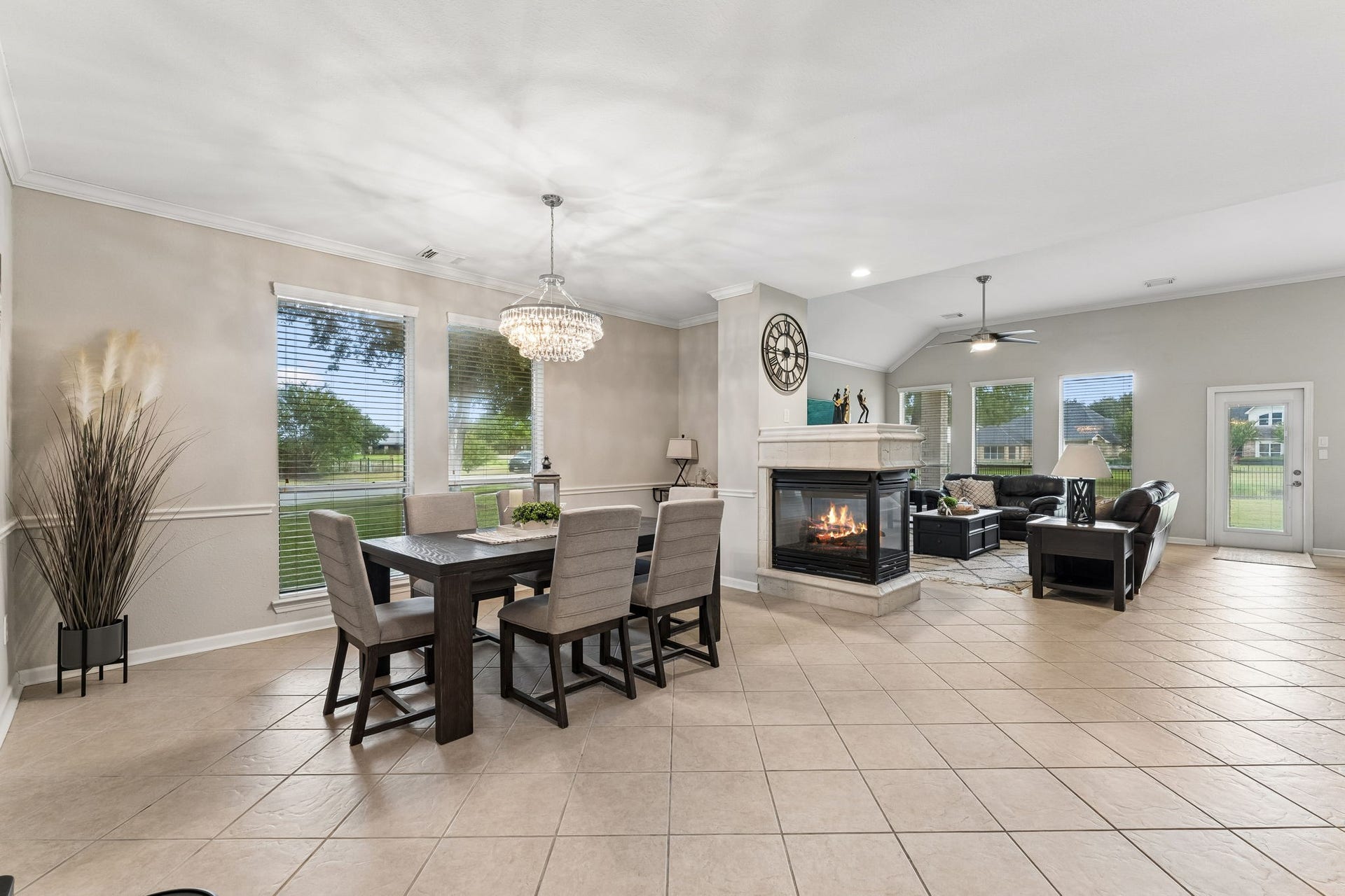 13050 Forester Canyon Lane, Sugar Land, TX 77498 Dual-sided fireplace divides the formal dining from the family room.