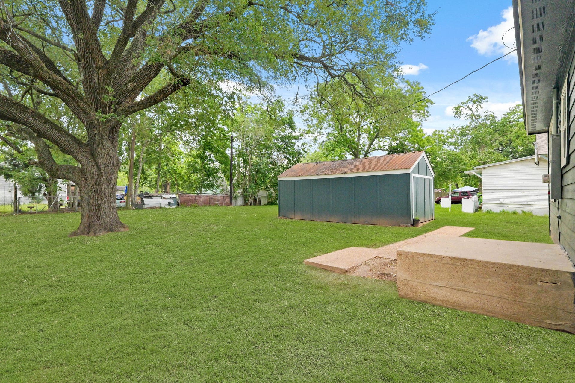 A convenient storage shed on the property offers extra space for tools, equipment, or seasonal items.