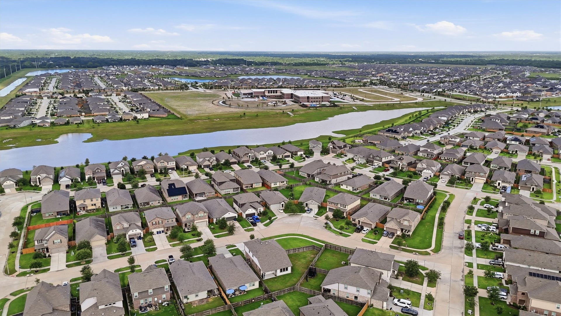 2130 Shellbark Way, La Marque, TX 77568 Aerial photo showcasing a portion of Lago Mar. A scenic waterway and community facilities are visible, offering a serene living environment.