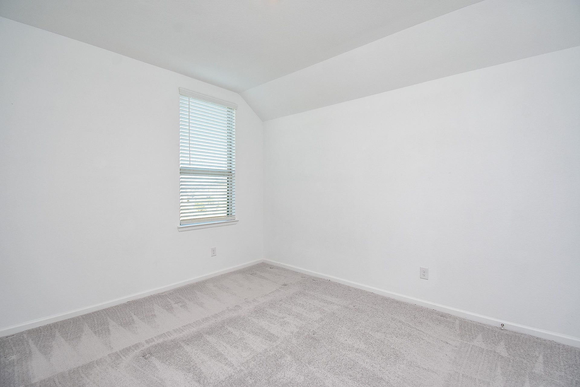 The third bedroom located upstairs.
