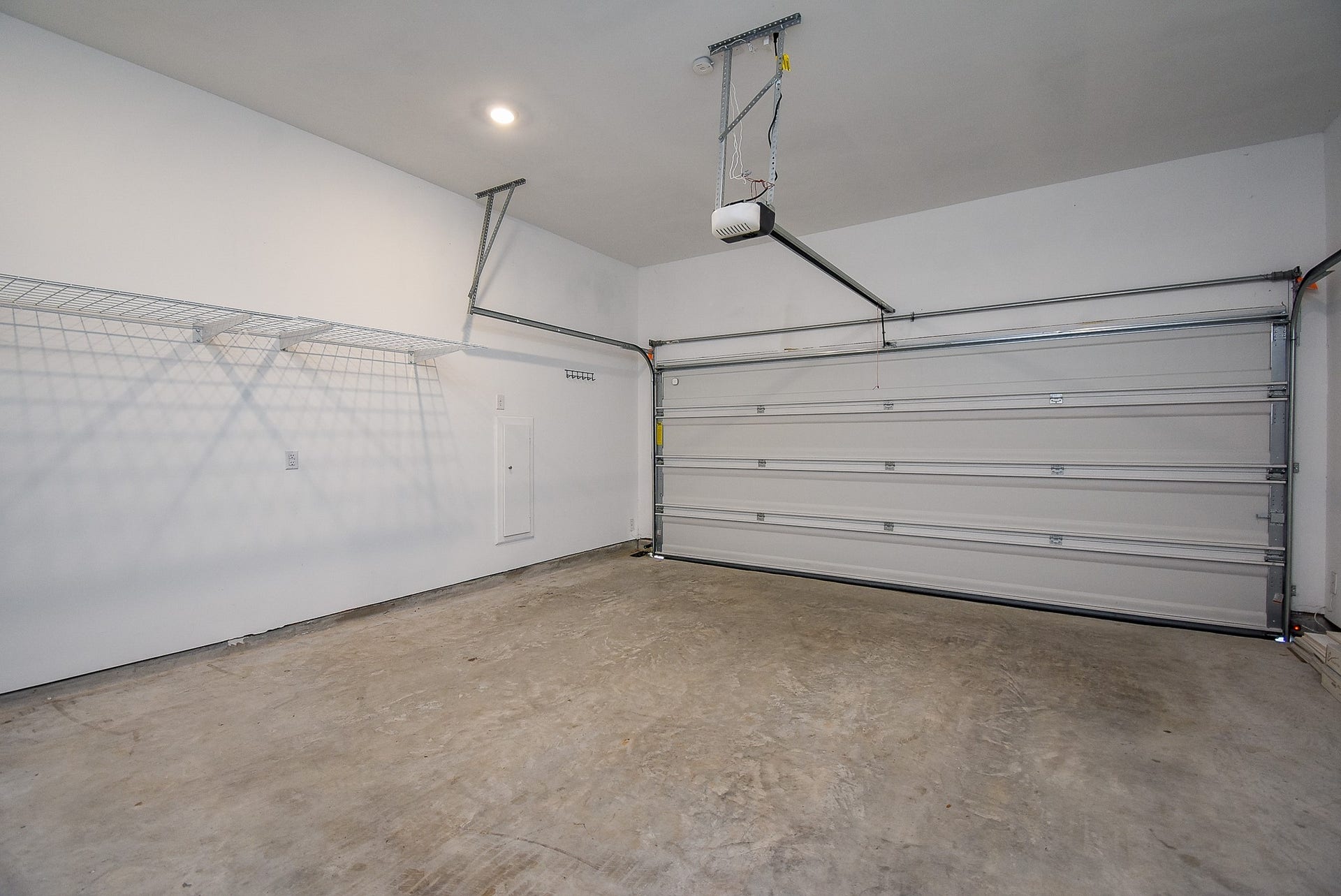 The large two car garage with an automatic door has plenty of space for your vehicles and some additional storage.