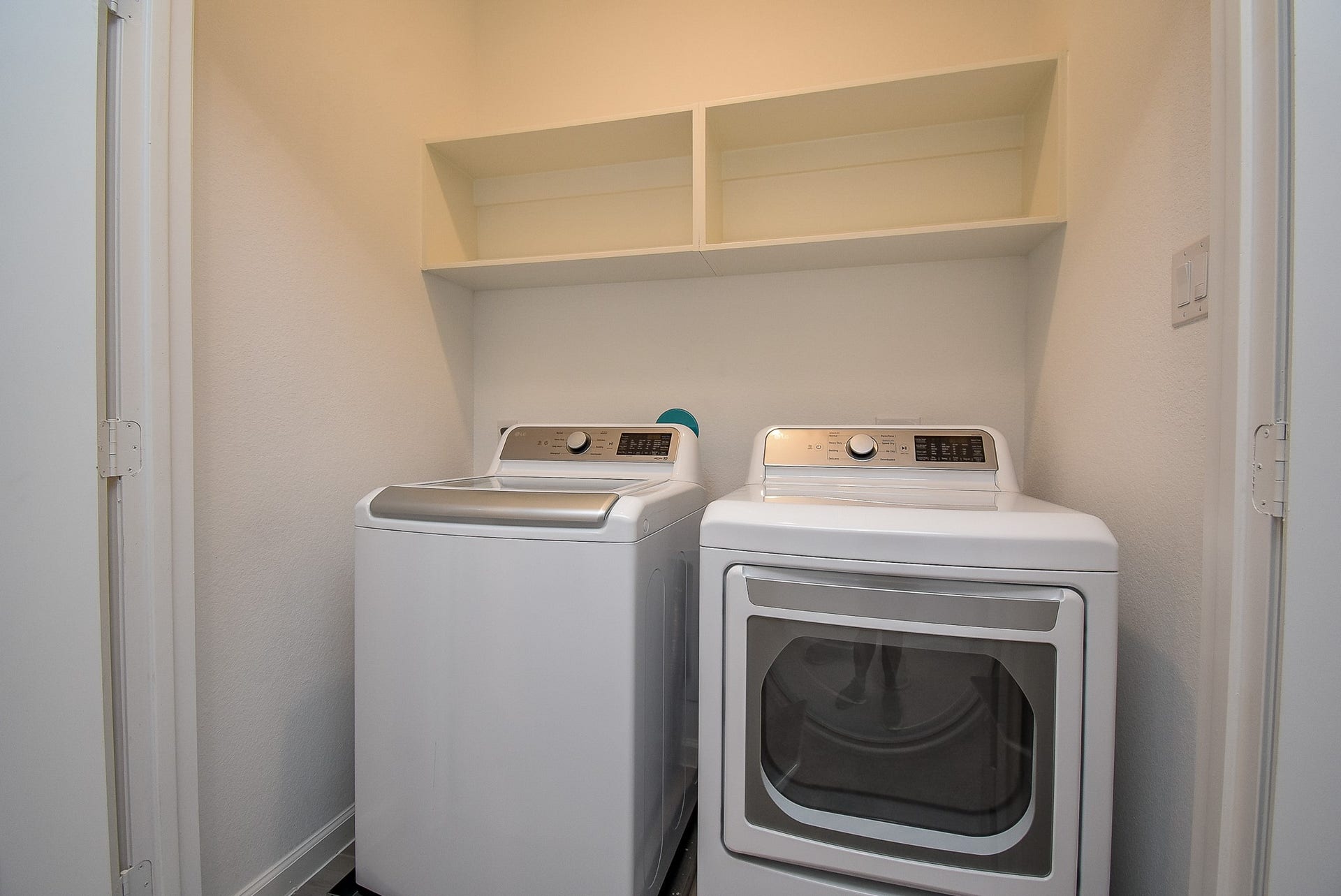 Just off the upstairs hallway and flex room is the utility closet with built in shelving and a like new washer and dryer set.