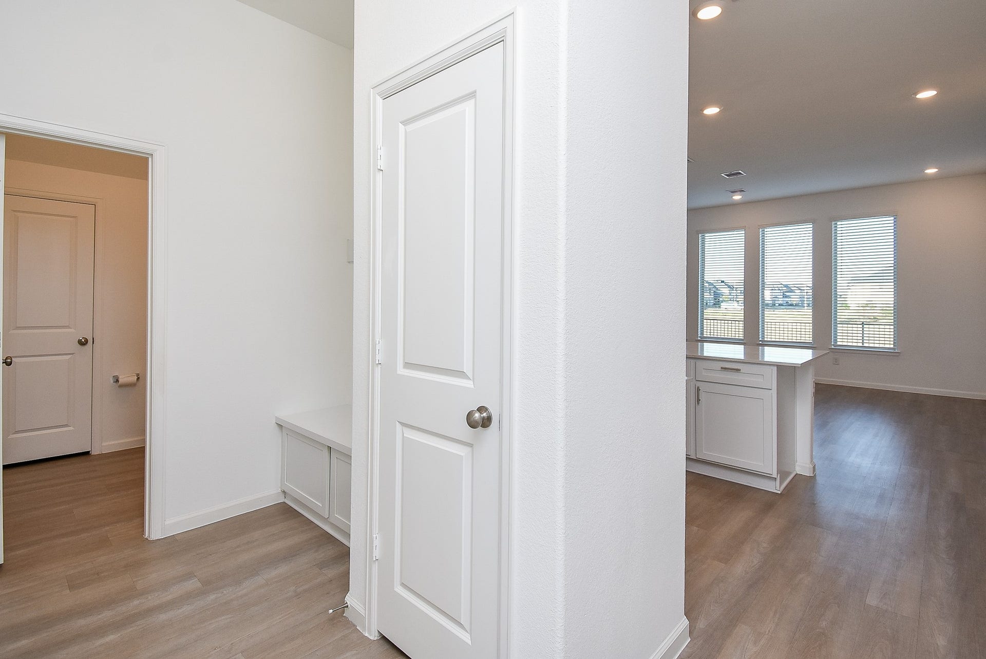 Step inside from the garage to the built in mud area and coat closet.