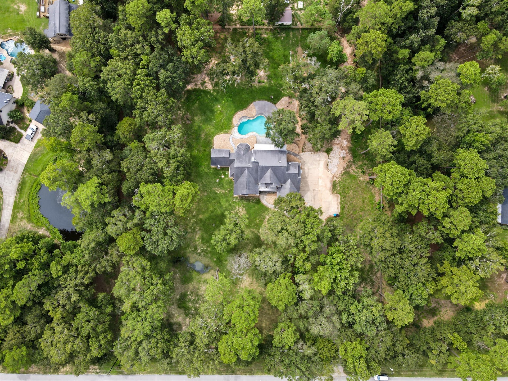 Nestled amidst lush greenery, this expansive property also features a sepearte entrance/exit with direct acess to 1488.