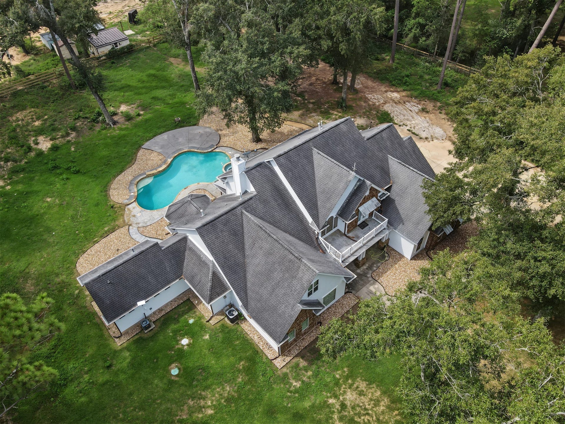 Nestled amidst lush greenery, this expansive property also features a sepearte entrance/exit with direct acess to 1488.