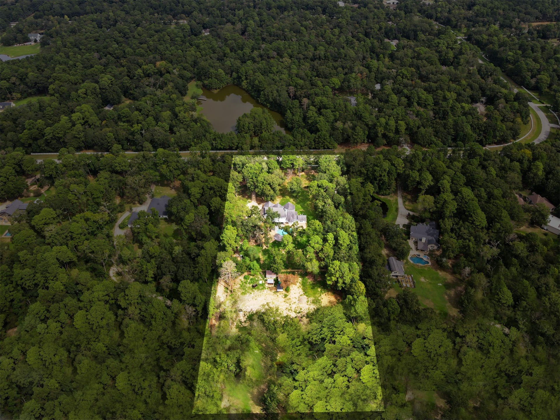 Expansive wooded property offering privacy and tranquility in a serene natural setting.