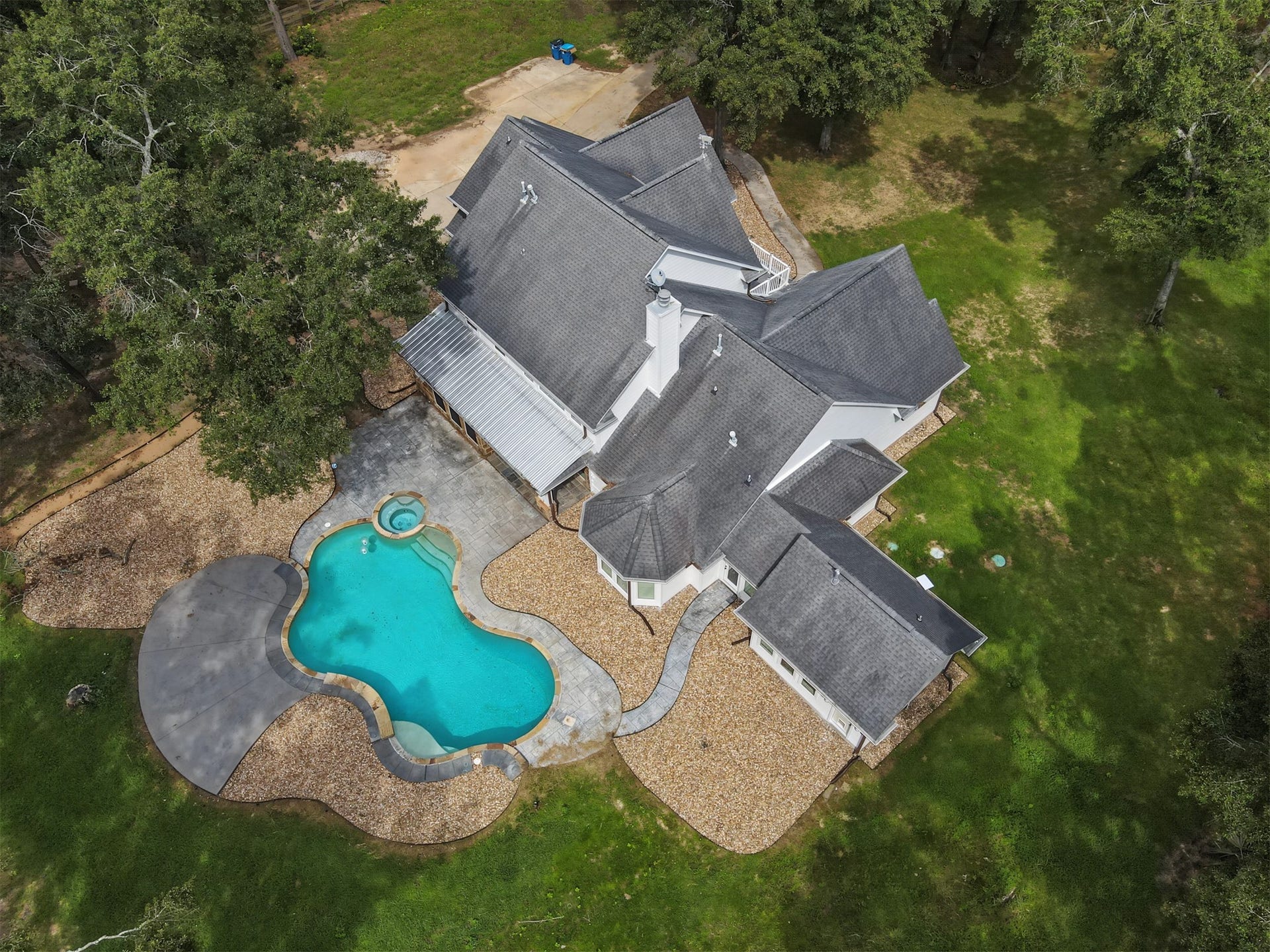 Nestled amidst lush greenery, this expansive property also features a sepearte entrance/exit with direct acess to 1488.