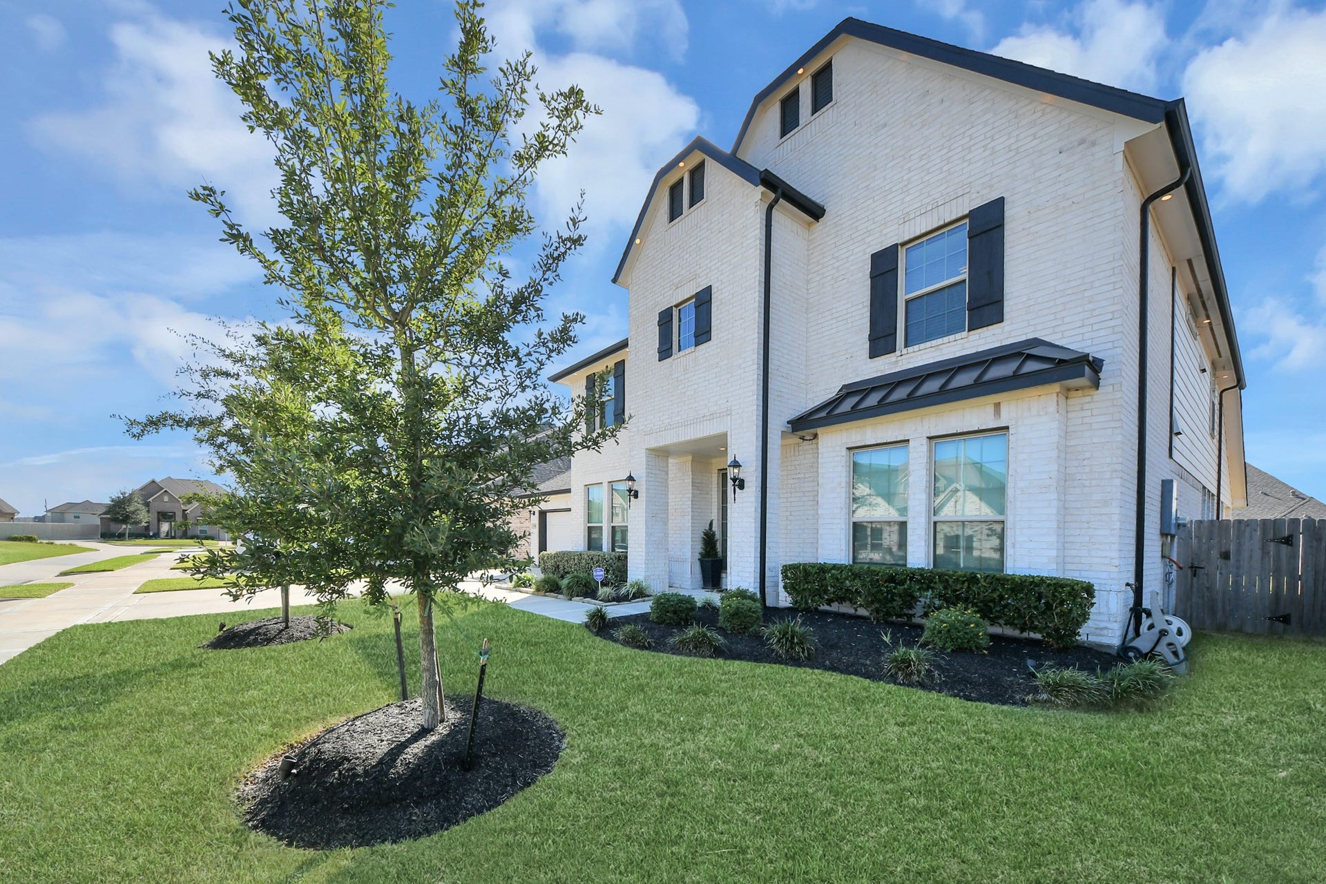 5542 Fairfield Lane, Pasadena, TX 77505 Elegant two-story home with a charming brick exterior, well-maintained landscaping, and inviting curb appeal in a quiet neighborhood.
