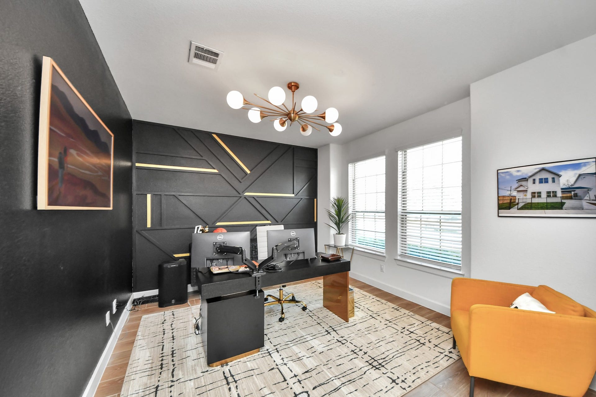 5542 Fairfield Lane, Pasadena, TX 77505 Chic home office with modern geometric accent wall, stylish lighting, and ample natural light from large windows.