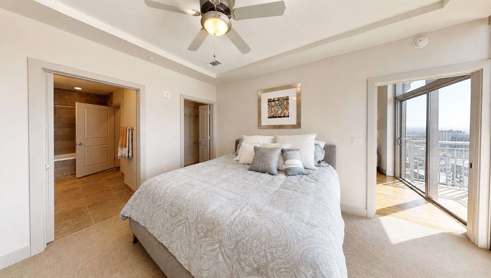 1400 McKinney Street, #2306, Houston, TX 77010 This bedroom has such a peaceful feel to it. Natural light, generous proportions and the ensuite bath create a space that feels removed from the pace of the city outside.