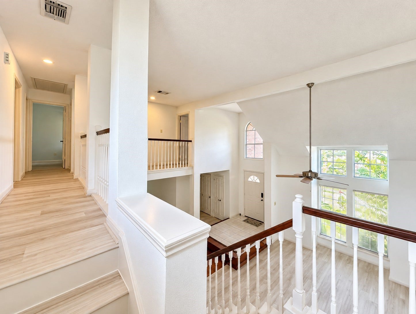 Upstairs landing overlooking the two-story entryway.