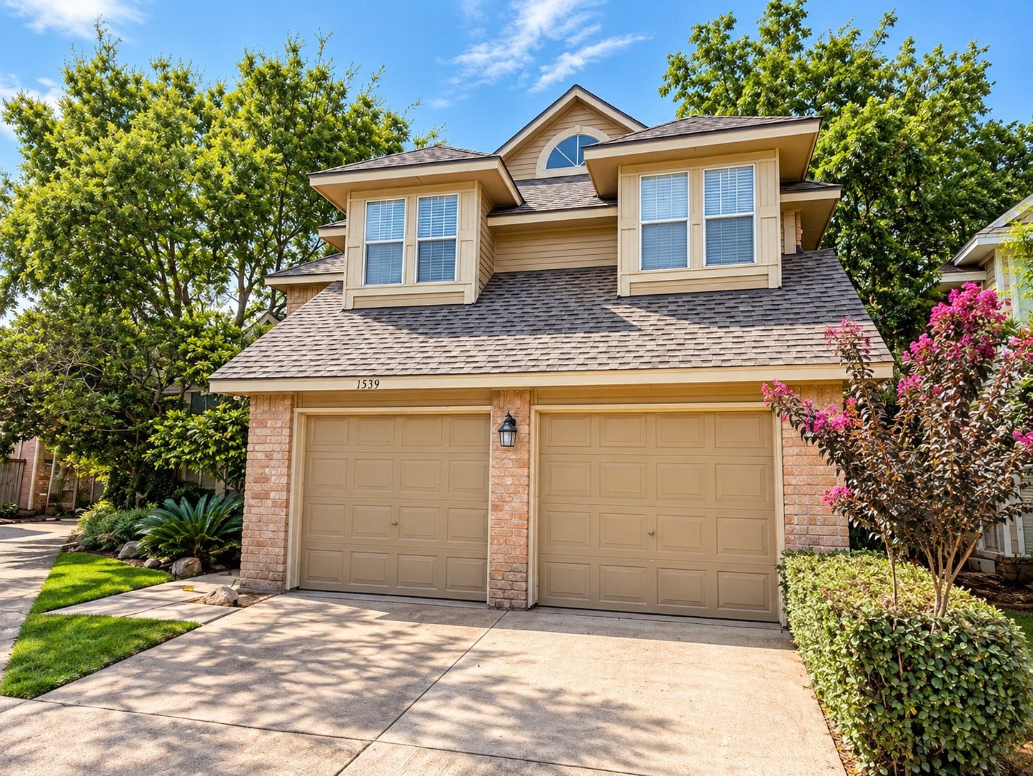 Front exterior showcasing the two-story design and attached garage.