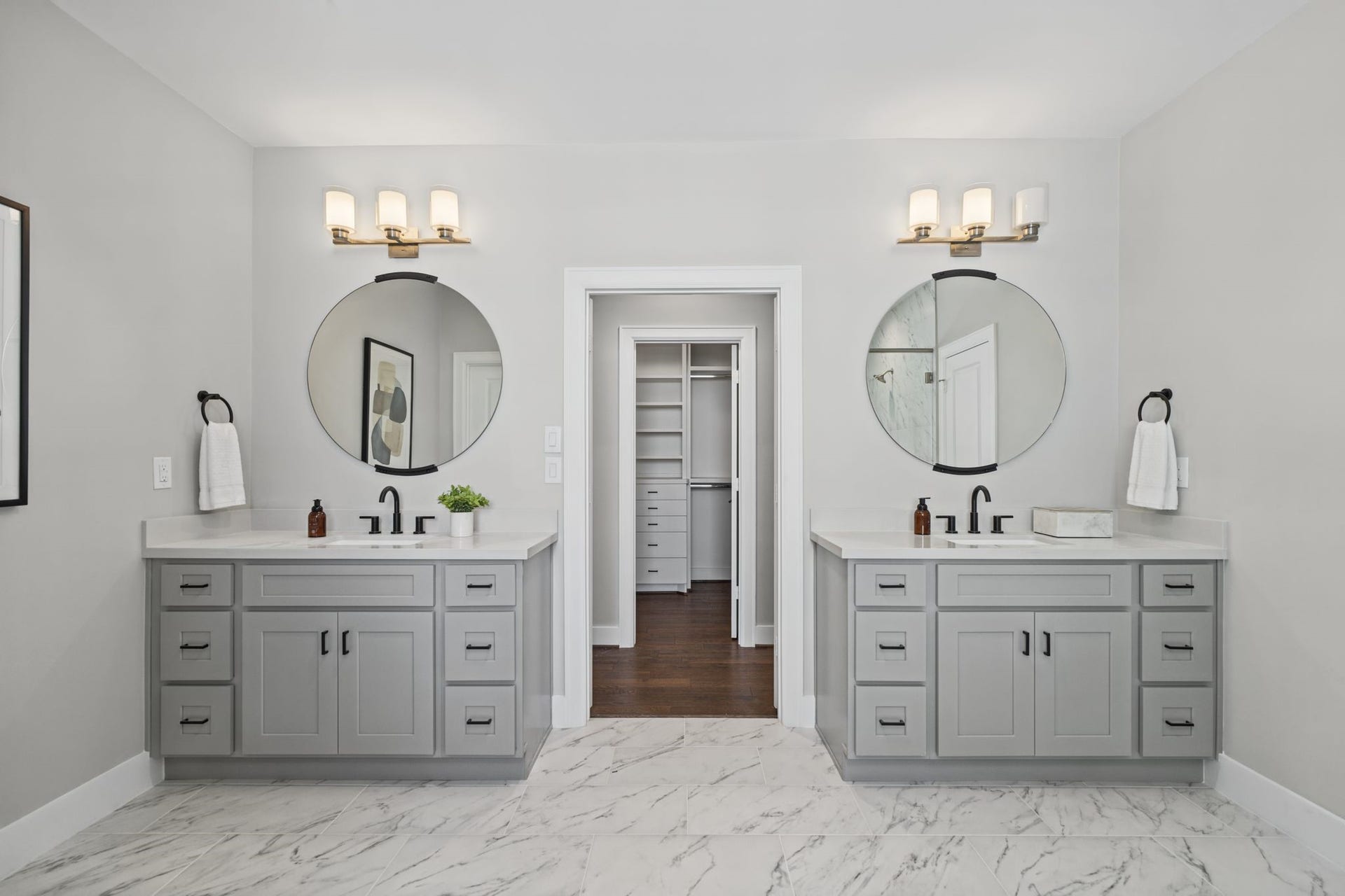 1538 Vermont Street, #A, Houston, TX 77006 Dual vanities, contemporary fixtures, framed mirrors, and elegant finishes deliver a polished, spa-inspired aesthetic.